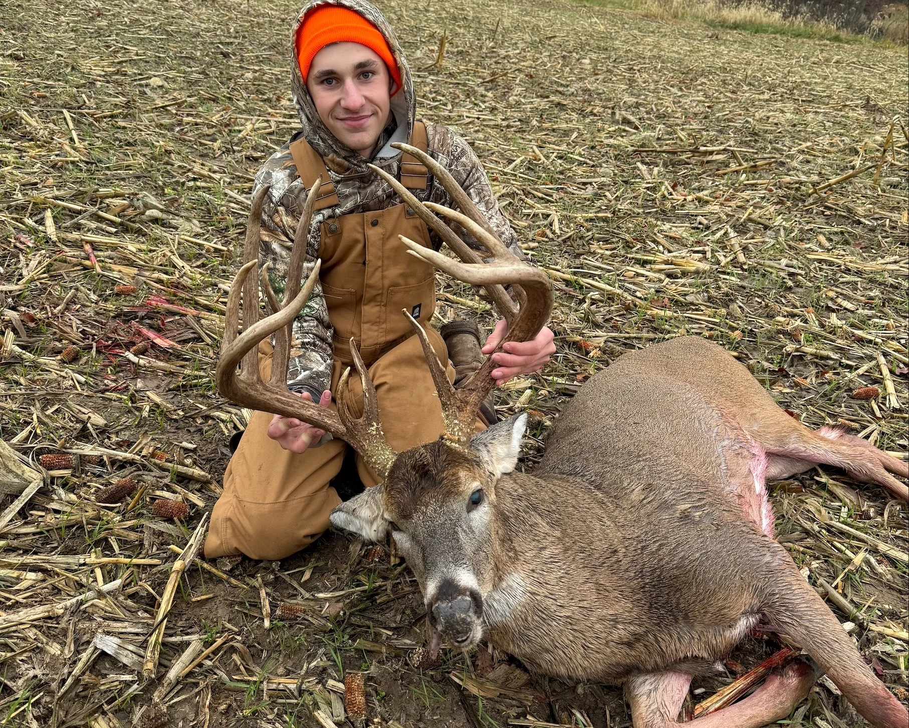 Hunter Ayden Bliss poses with a trophy whitetail buck. 