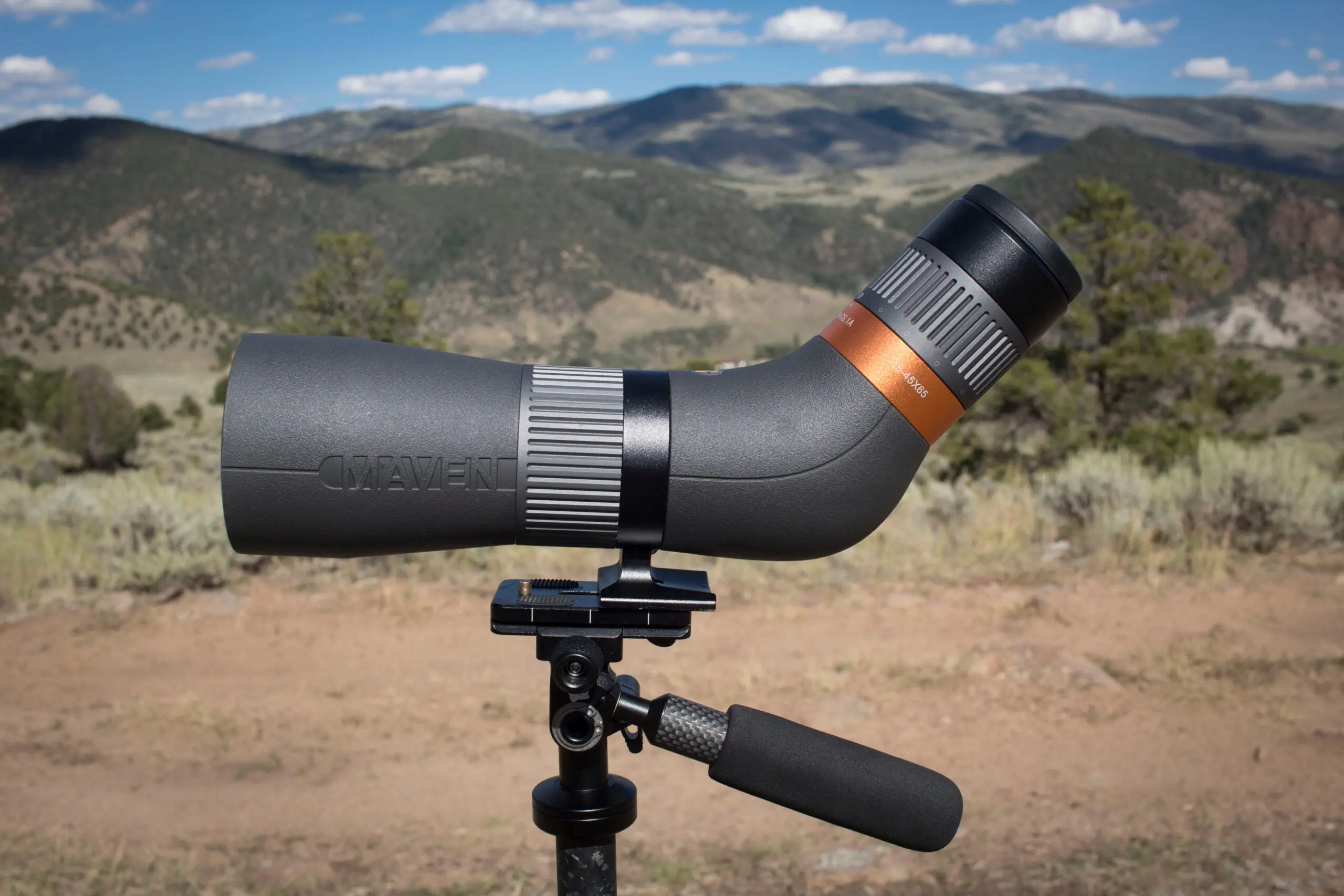 Maven CS.1A spotting scope on tripod with mountains in the background