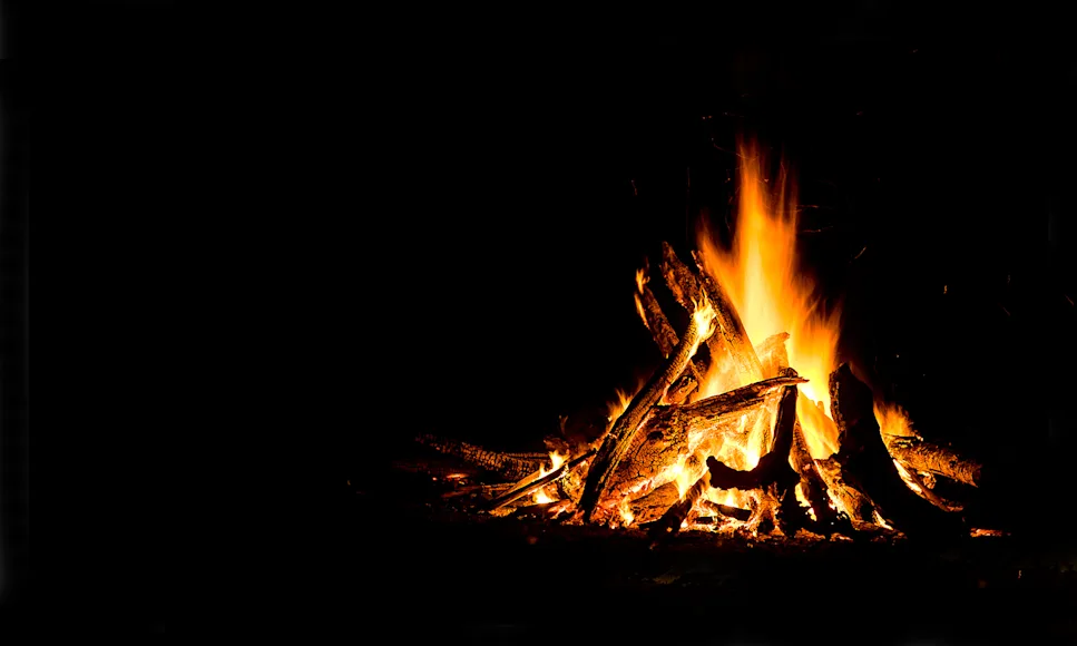 A campfire at night.