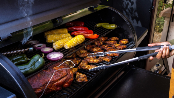 Man cooking on Pit Boss pellet grill