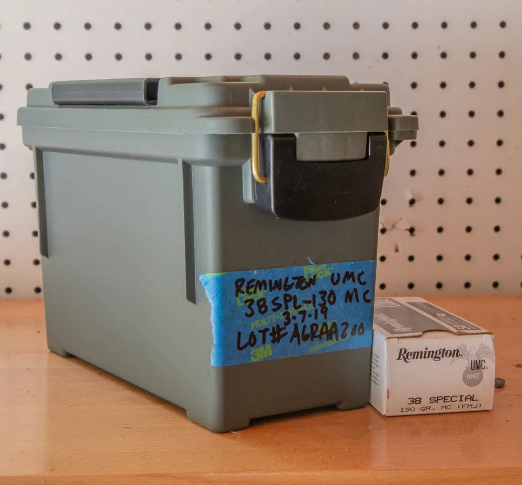 An ammo can on a work bench.