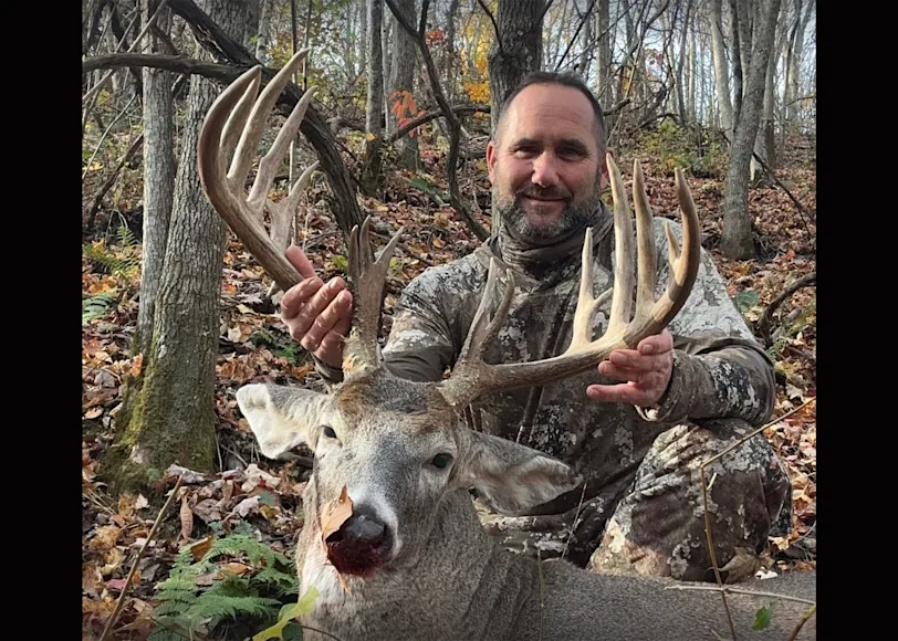 A hunter poses with a trophy buck taken in the mountains of West Virginia.