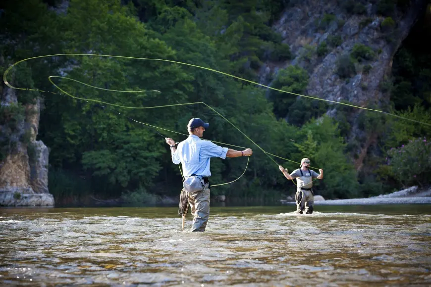 fly anglers fishing for trout