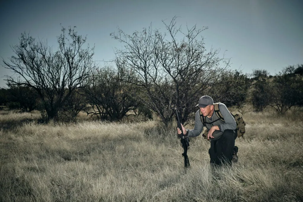 a rabbit hunter looks for jackrabbits in the southwest