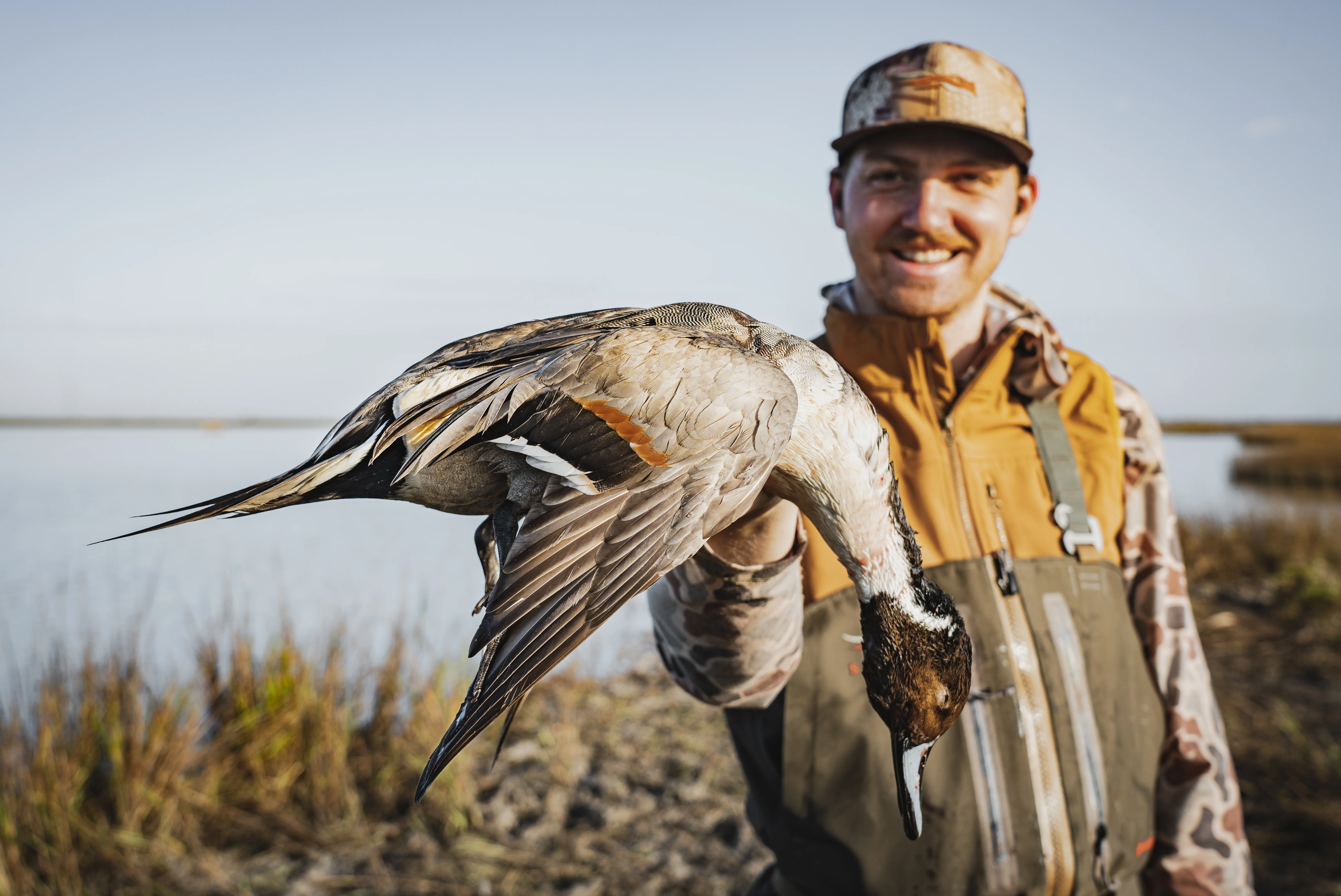 Hunter holding pintail