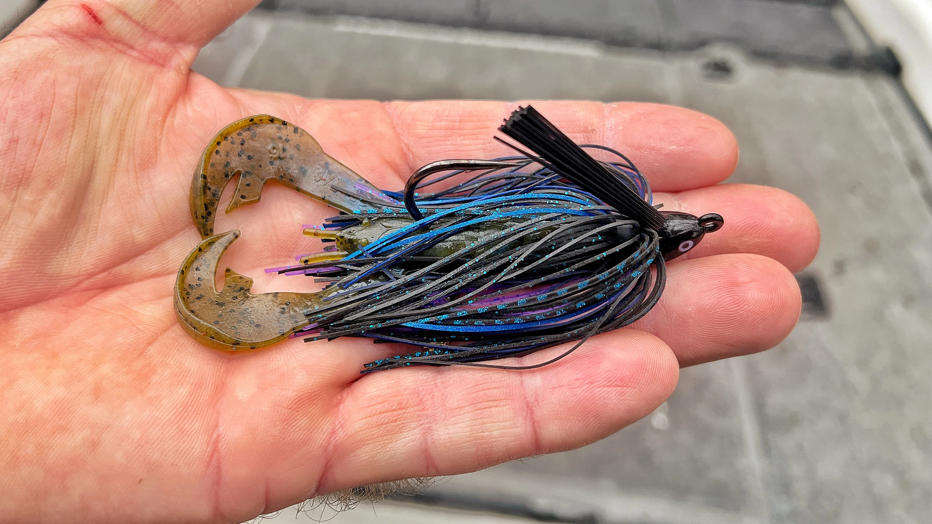 Angler holds swim jig in hand