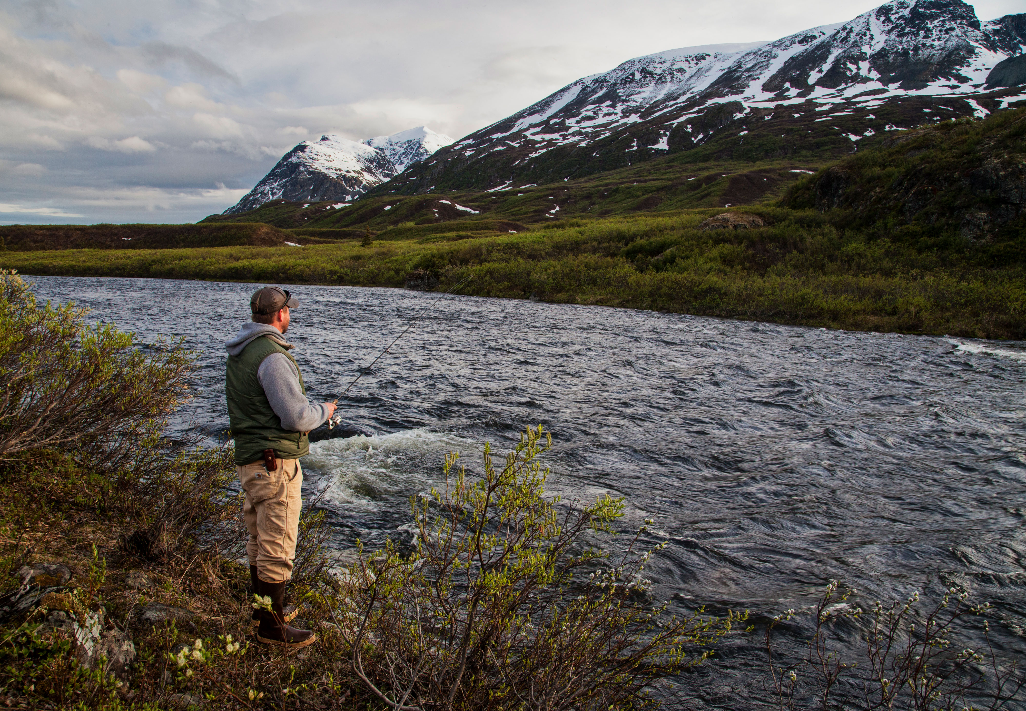 An angler fishes on Bureau of Land Management land in Alaska. 