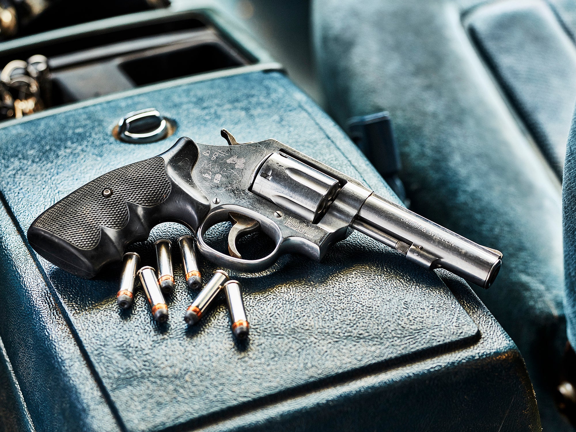Revolver on the center console of a truck.