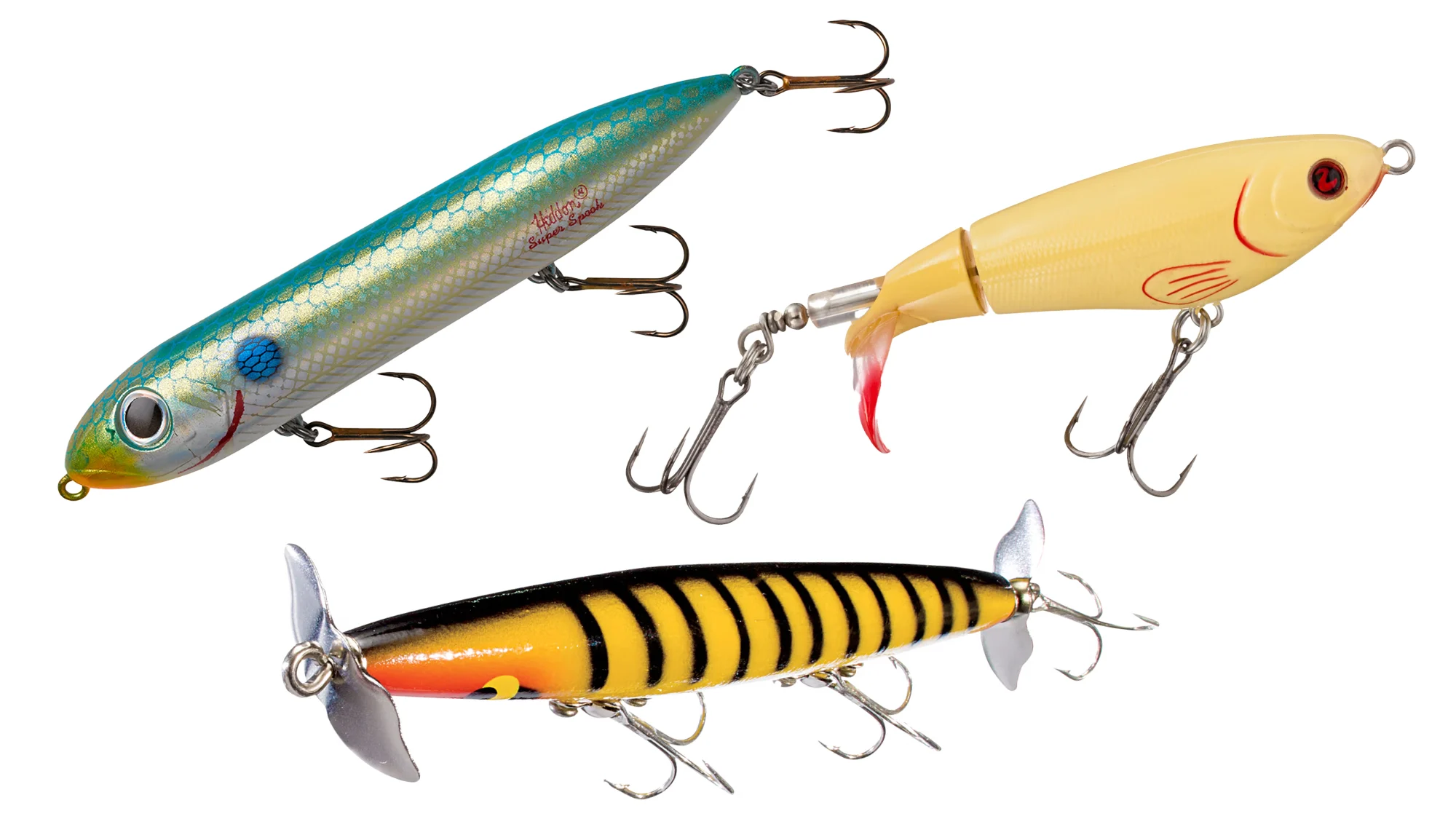 A topwater walking bait, plopper-style bait, and prop bait on white background.