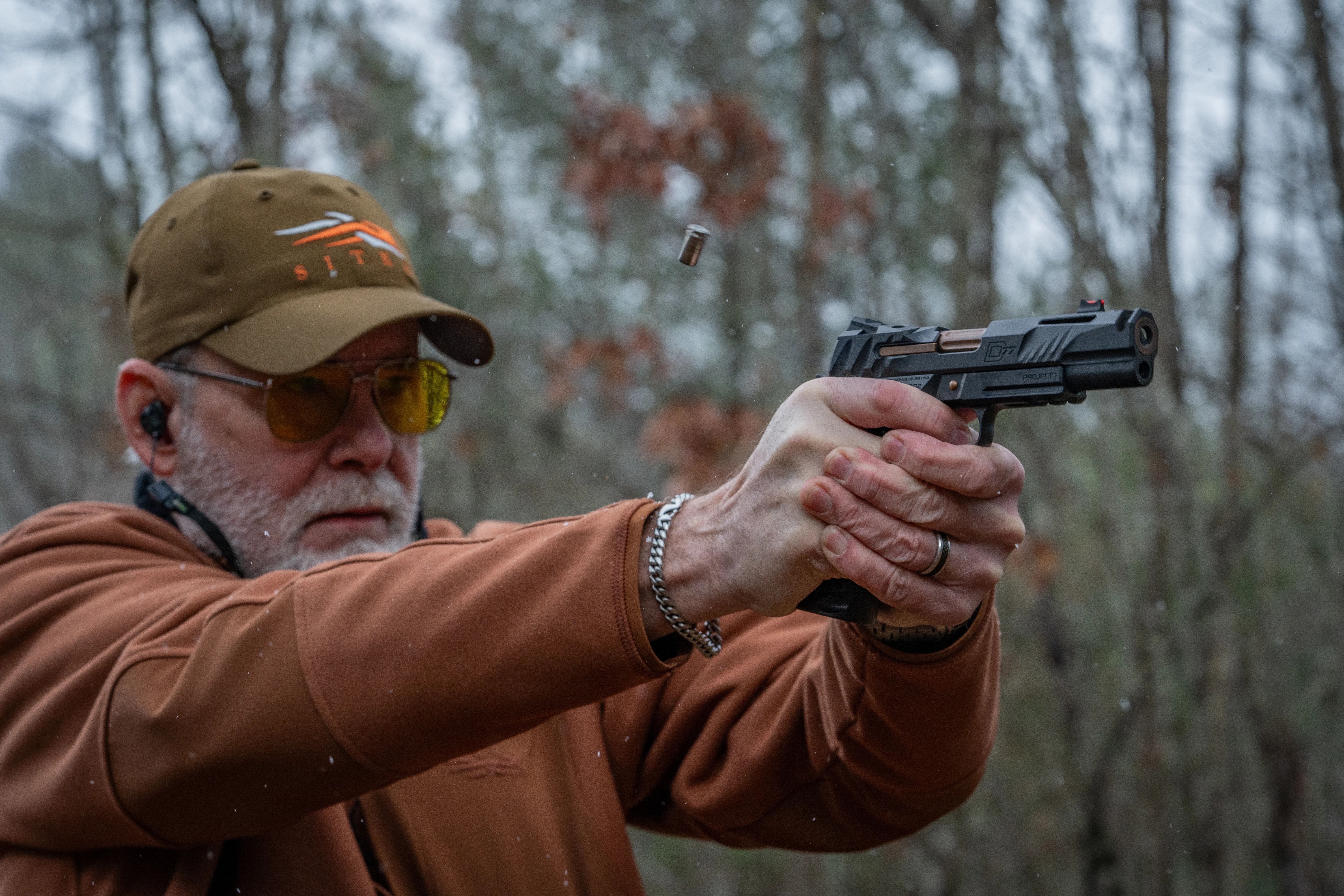 A shooter fires the new Wilson Combat P1 D77 1911 on an outdoor range. 