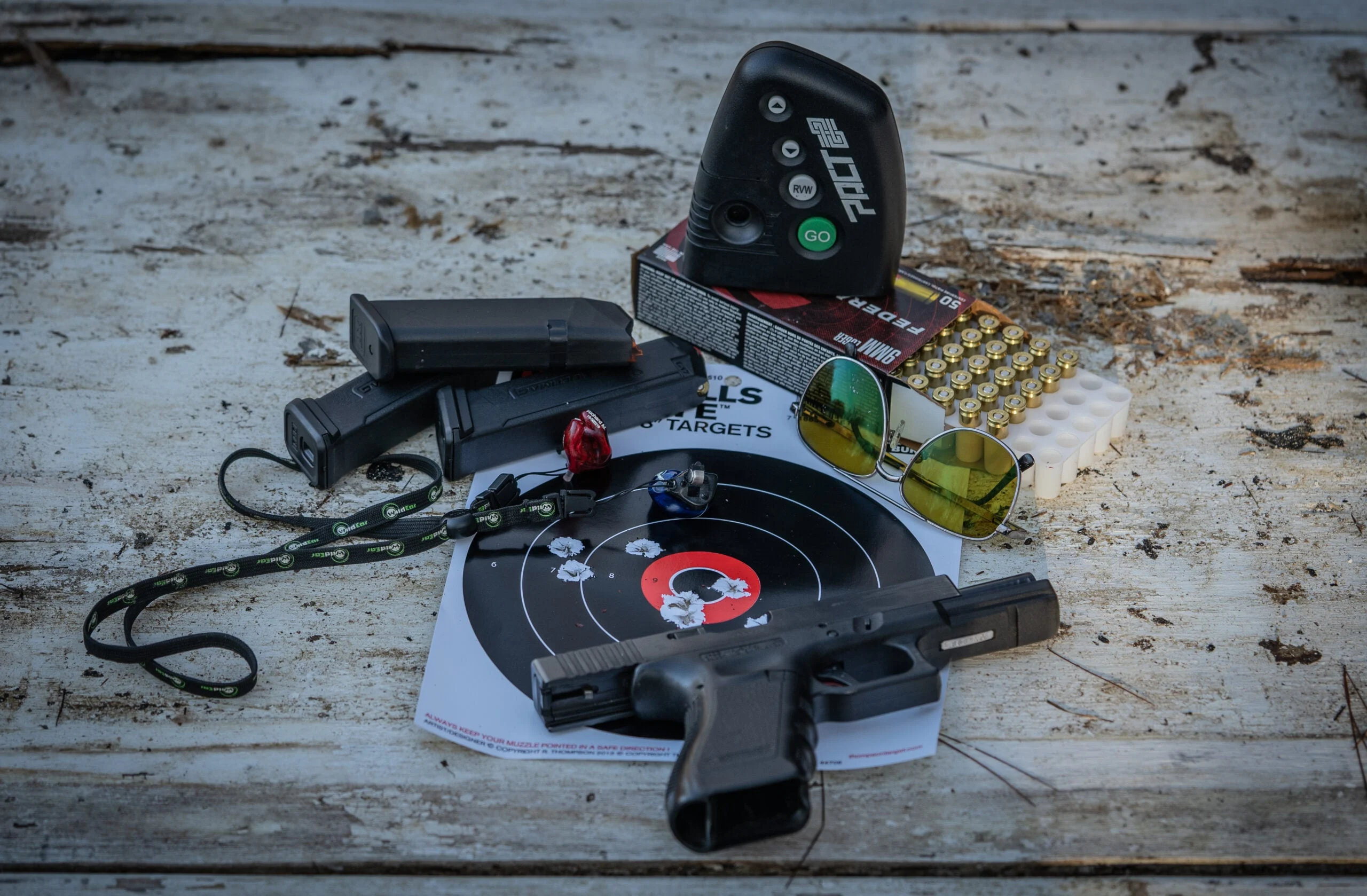 photo of a Glock 17 with target and ammo