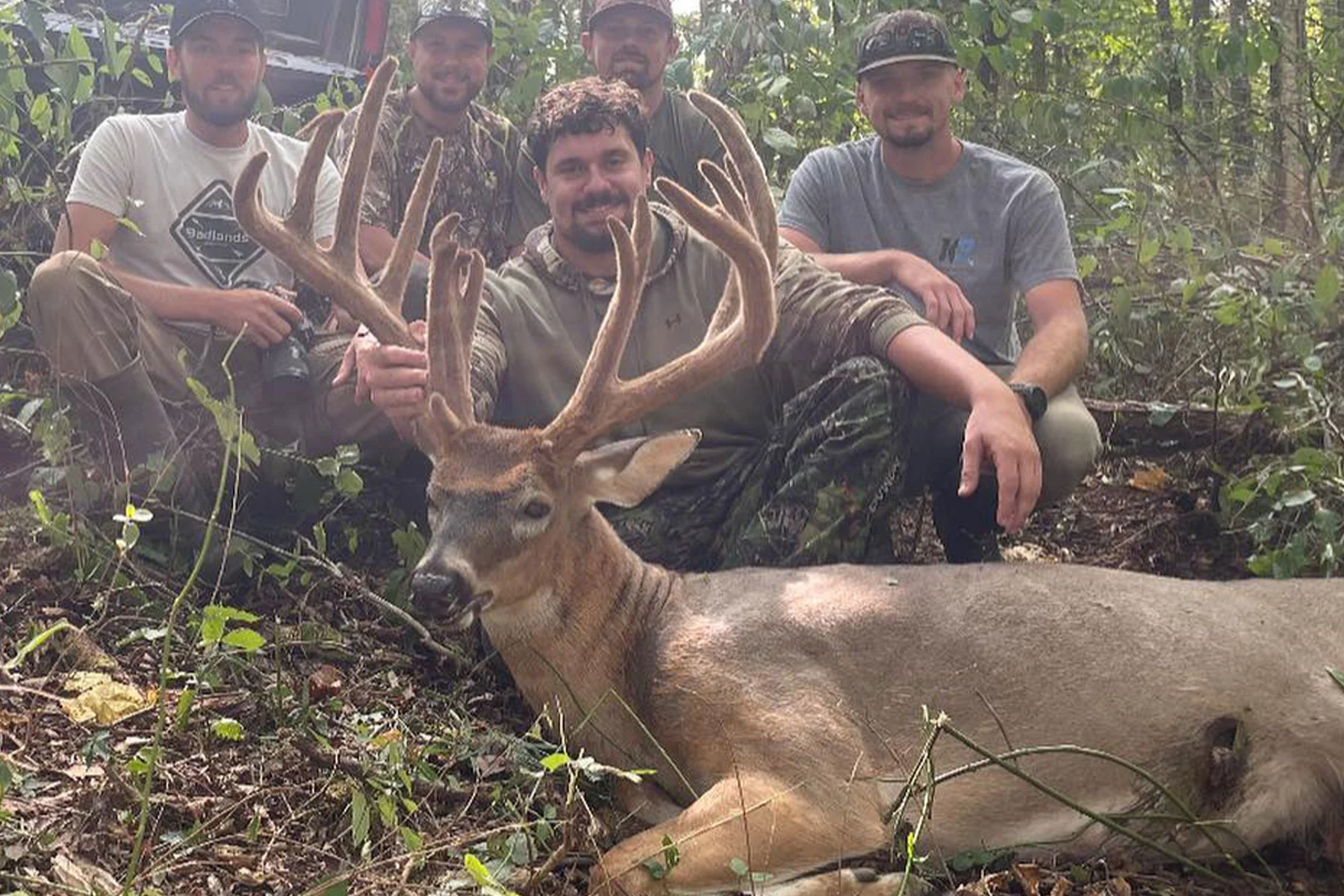 Hunter poses with 200-inch full-velvet whitetail. 