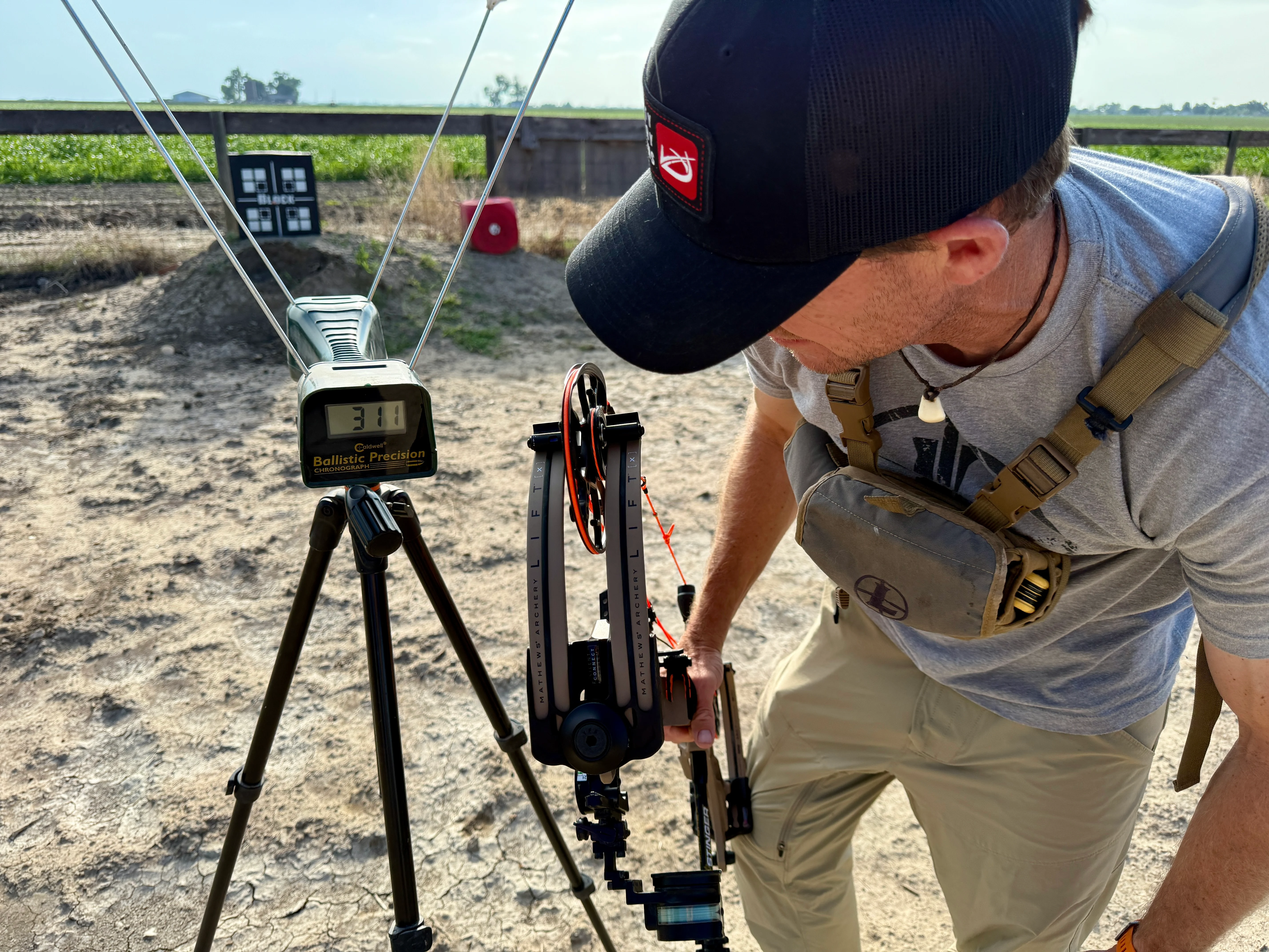 An archer uses a chronograph to test the speed of a bow. 