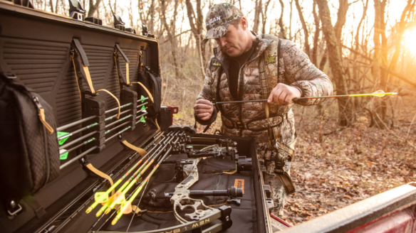 Hunter putting compound bow in Pelican 1745 Bow Case