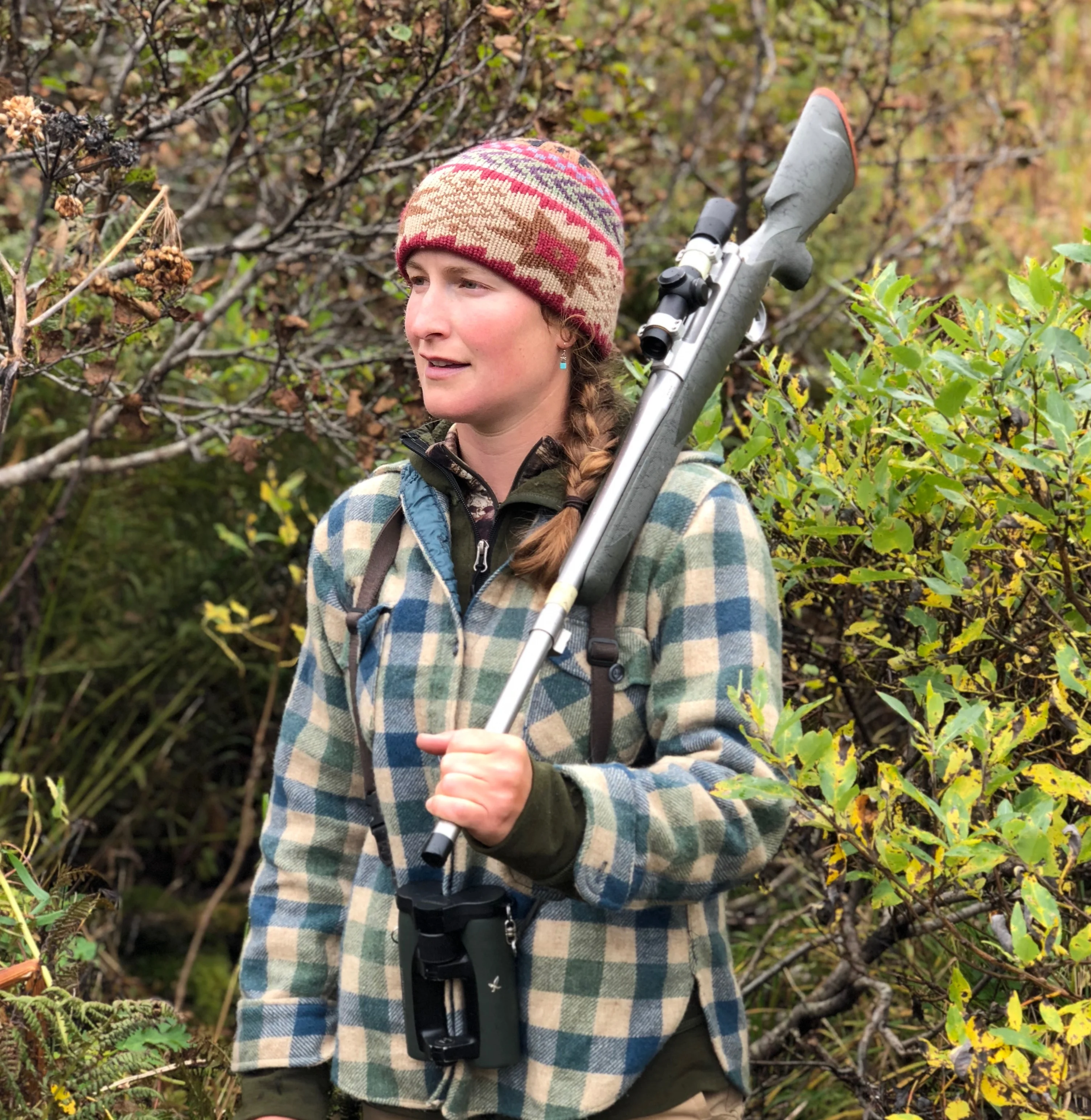 Alaska bear guide Tia Shoemaker with Echols rifle slung over her shoulder. 