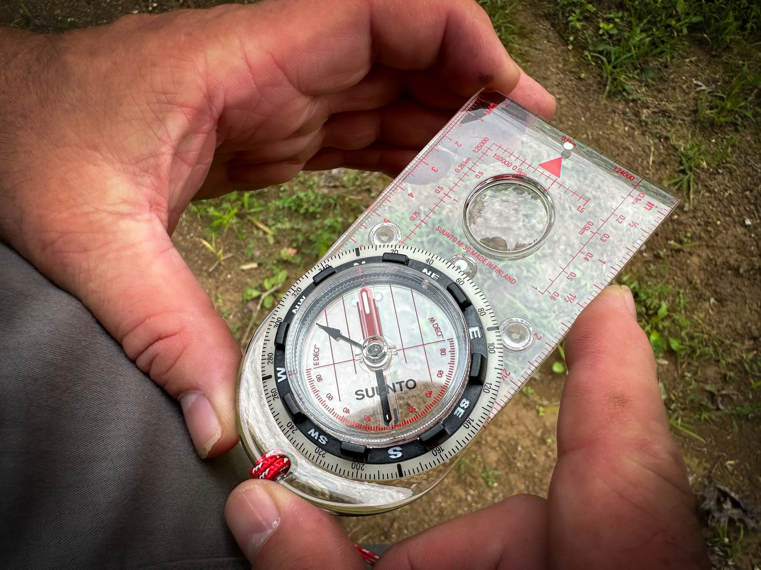 hiker holding a compass