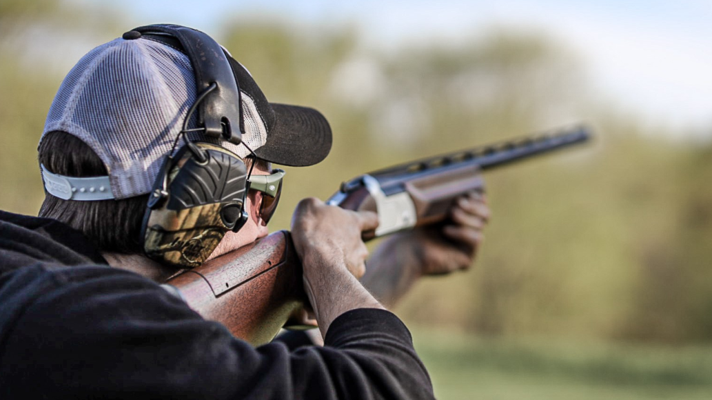 Man shooting Savage Arms Rifle