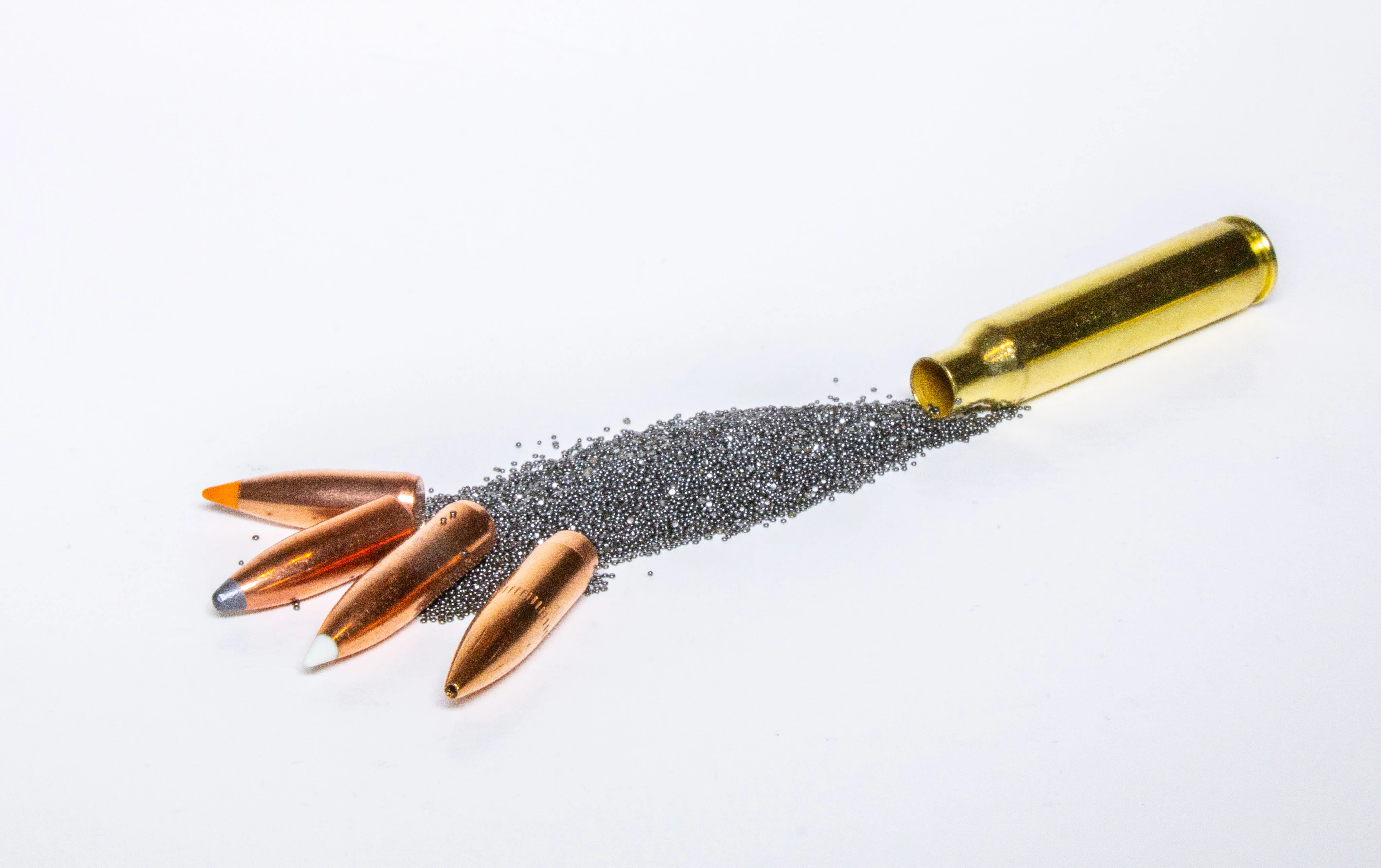Three bullets, two casings, and a pile of gunpowder.