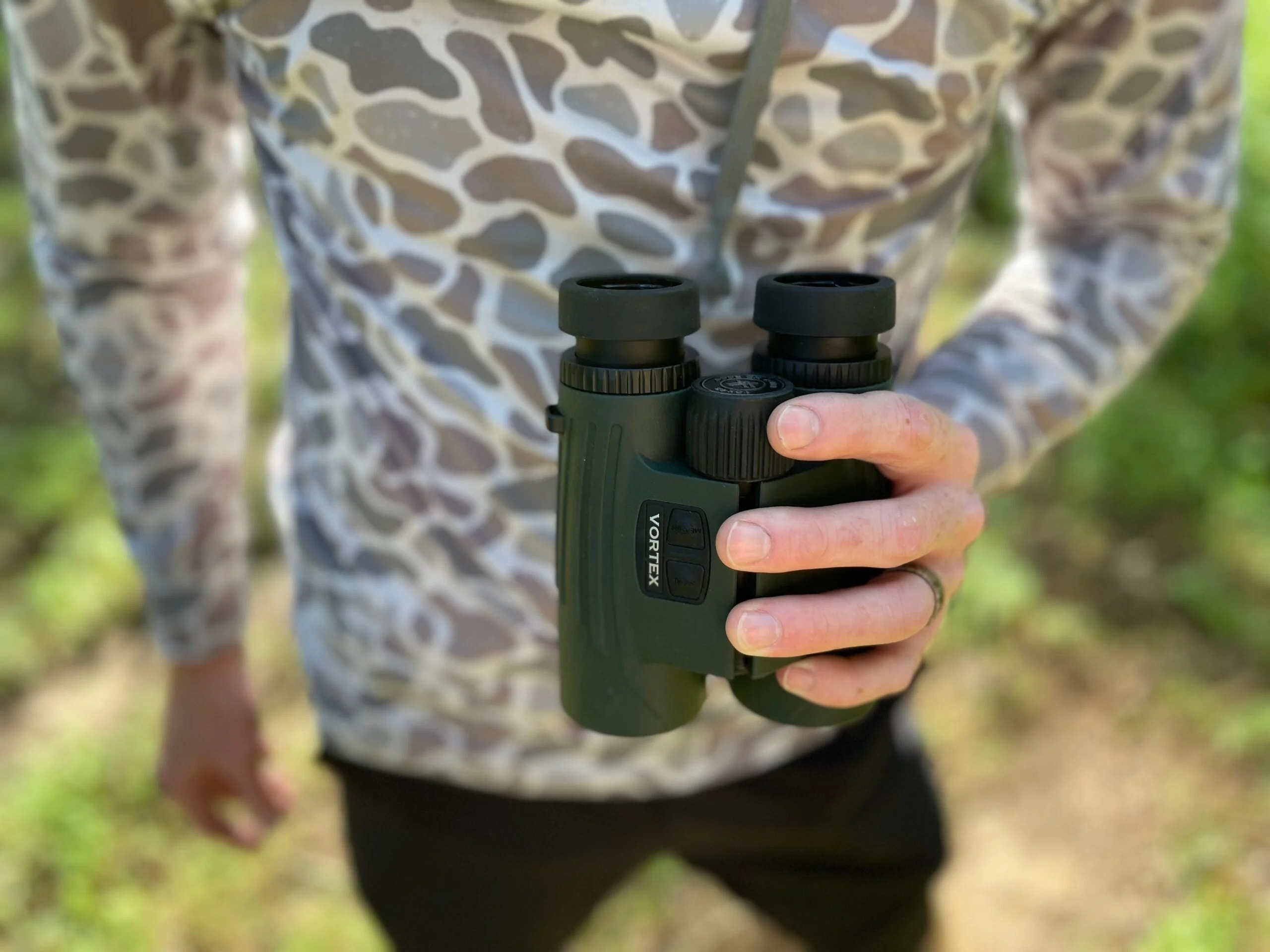 Man holding Vortex Fury Rangefinder Binoculars