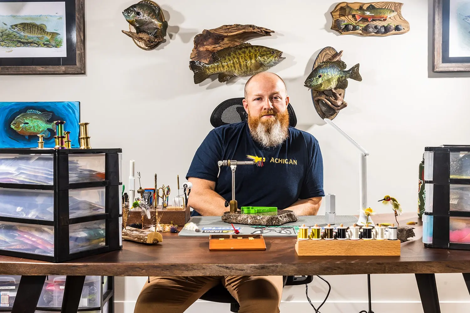 Fly-tier Brandon Bailes at his very tidy workshop desk