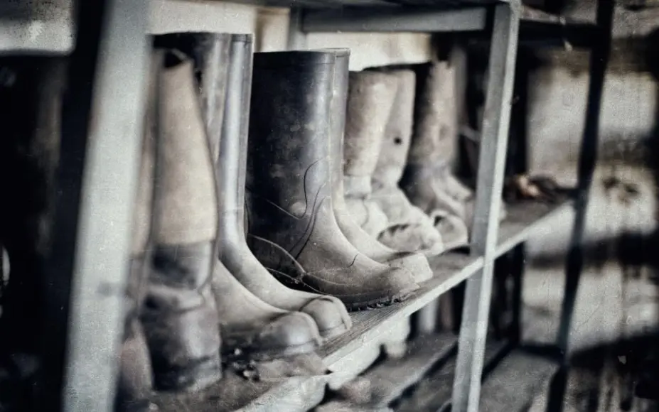 Rubber hunting boots on the shelf