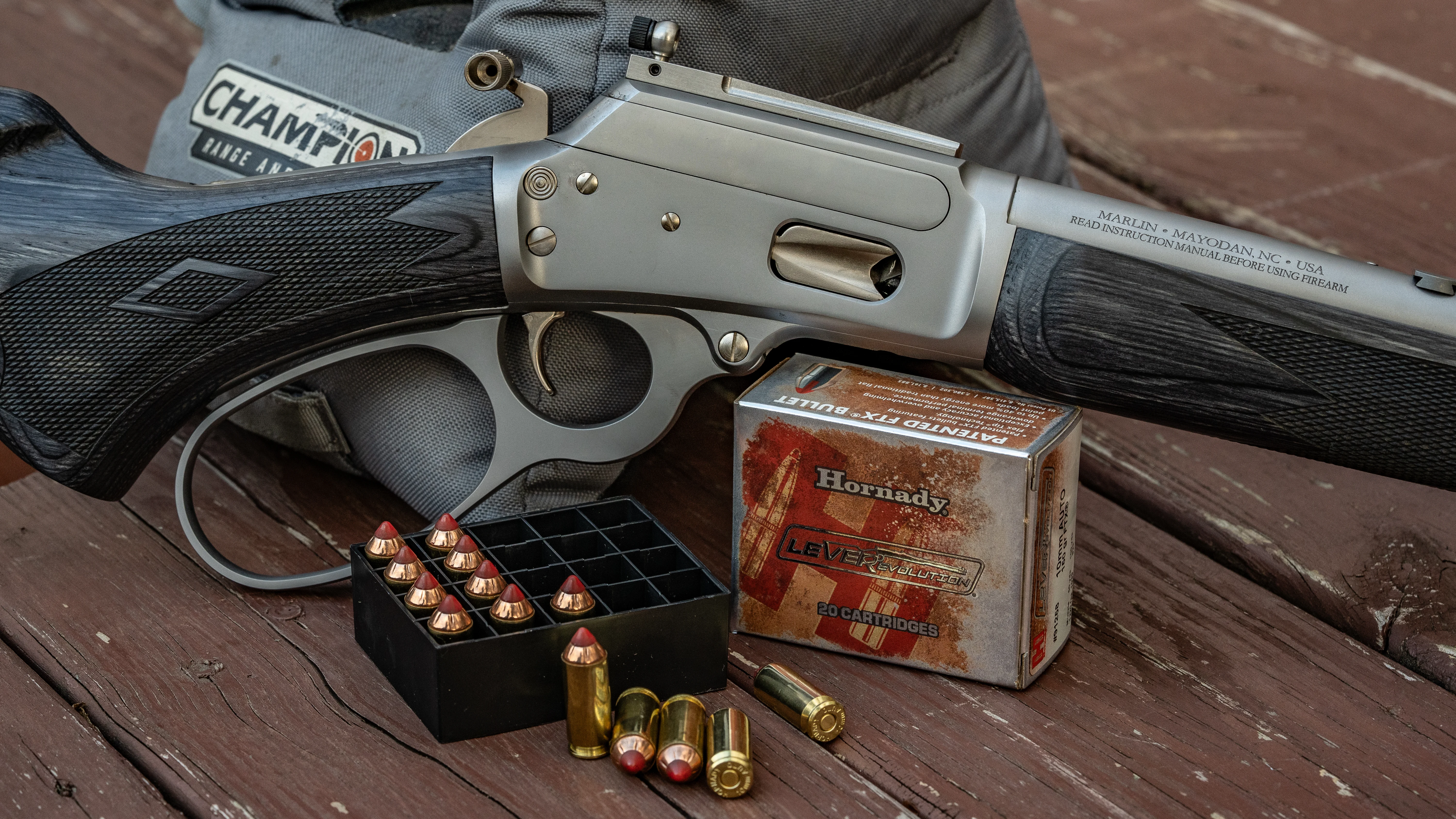 Marlin 1894 Trapper 10mm Automatic Rifle with a box of ammo.