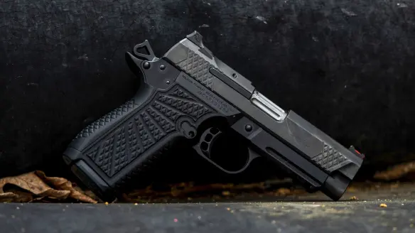 Wilson Combat SFX9 handgun sitting on a table.