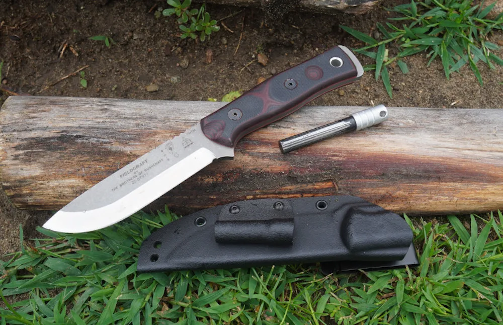 Tops Fieldcrafter knife laying on grass