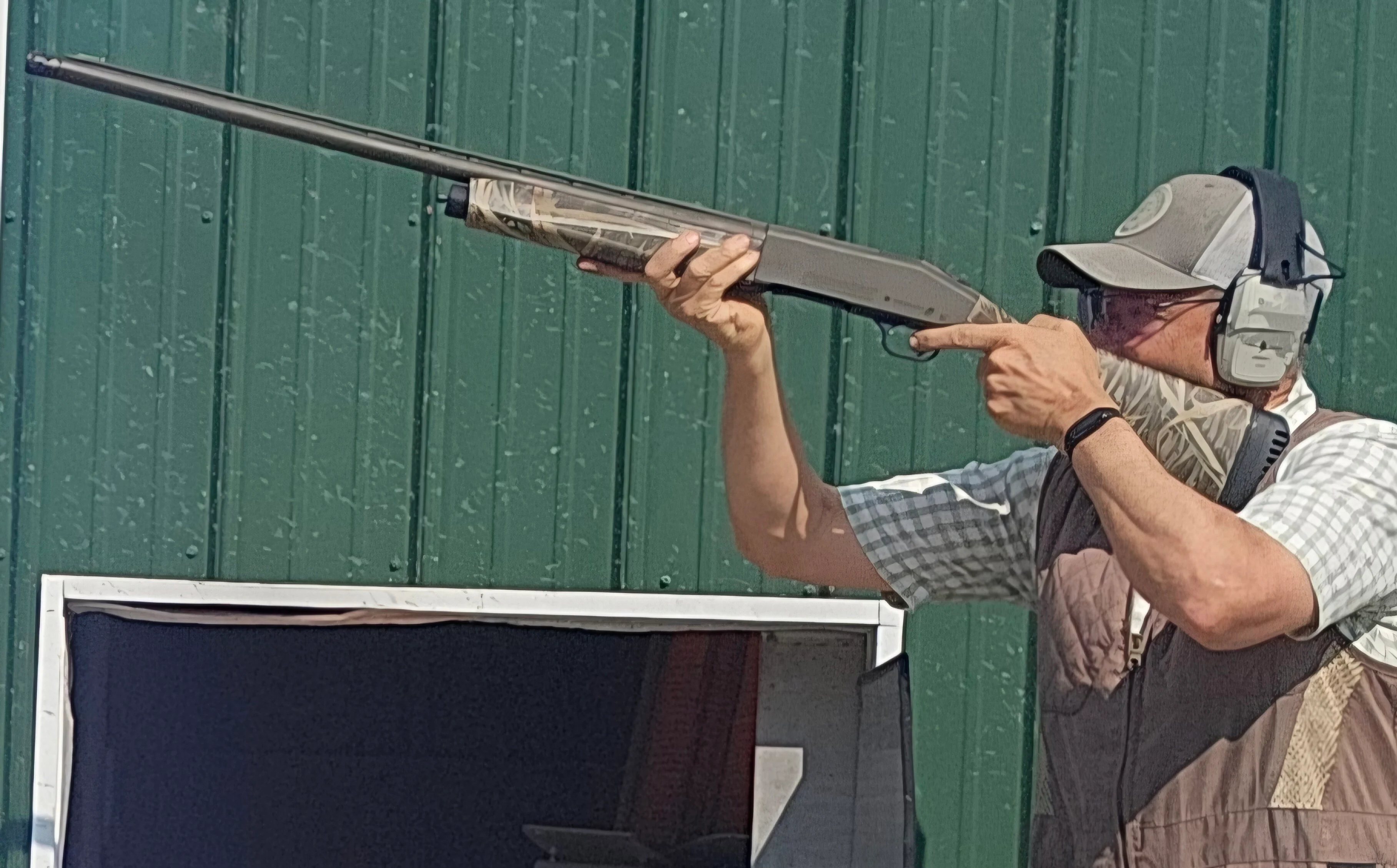 A shooter test fires the new Mossberg 940 Pro Waterfowl shotgun at a skeet range. 