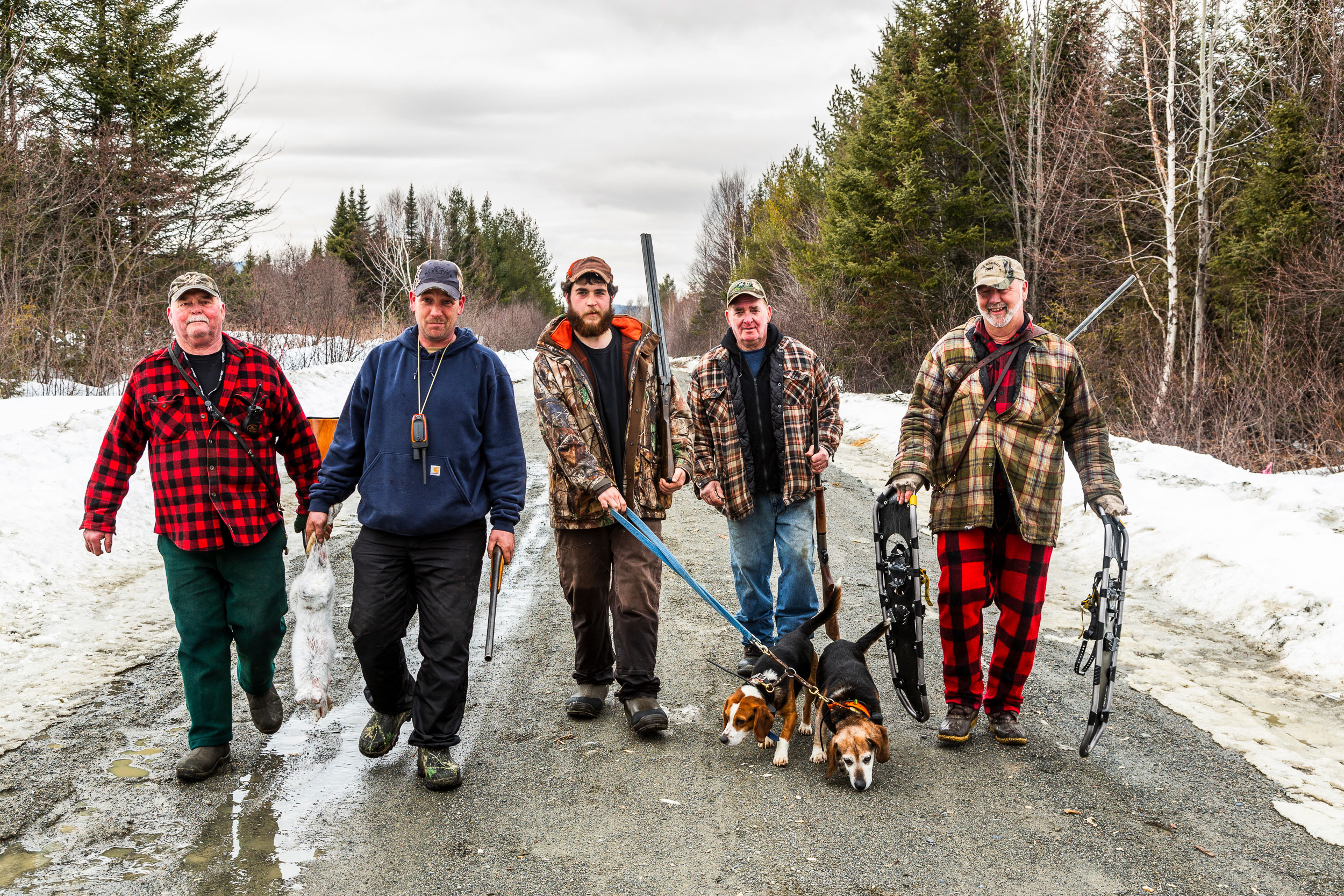A crew of snowshoe hare hunters head home after a successful hunt. 