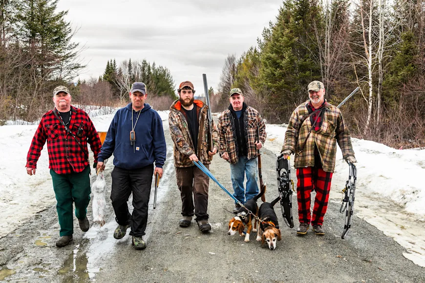 A crew of snowshoe hare hunters head home after a successful hunt.