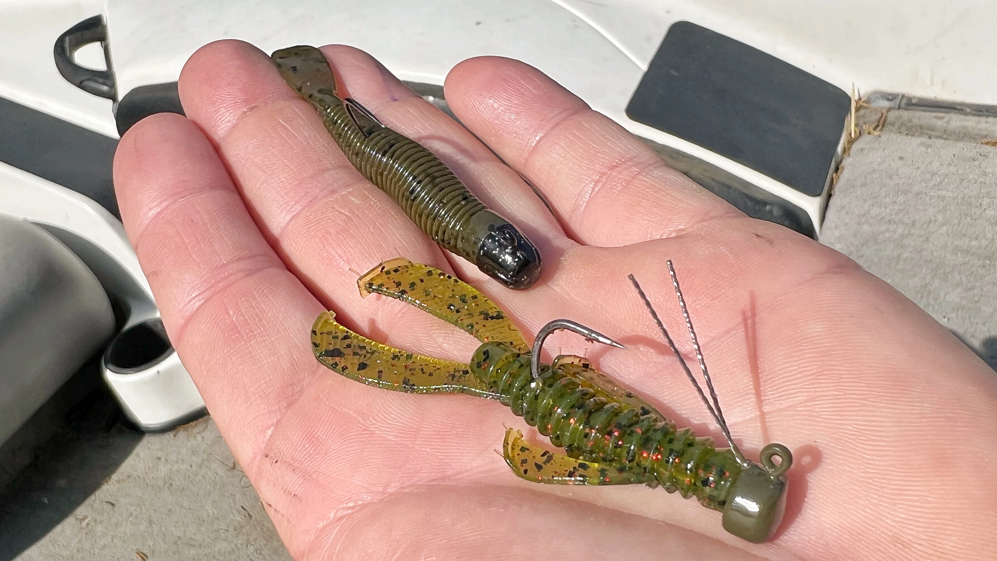 Two Ned rigs shown in the palm of an bass angler's hand. 