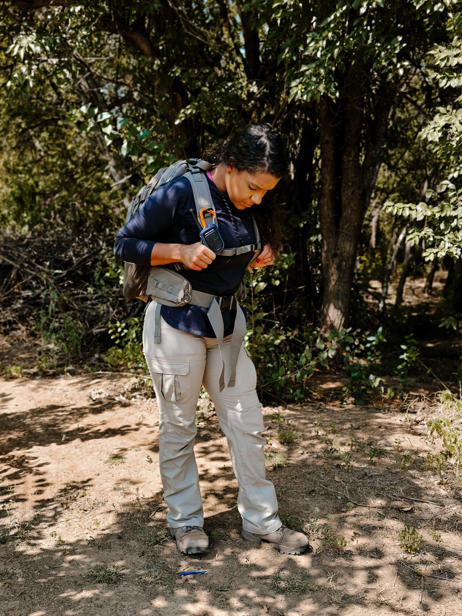 Woman wearing Rocky Talkie Mountain Radio in the field