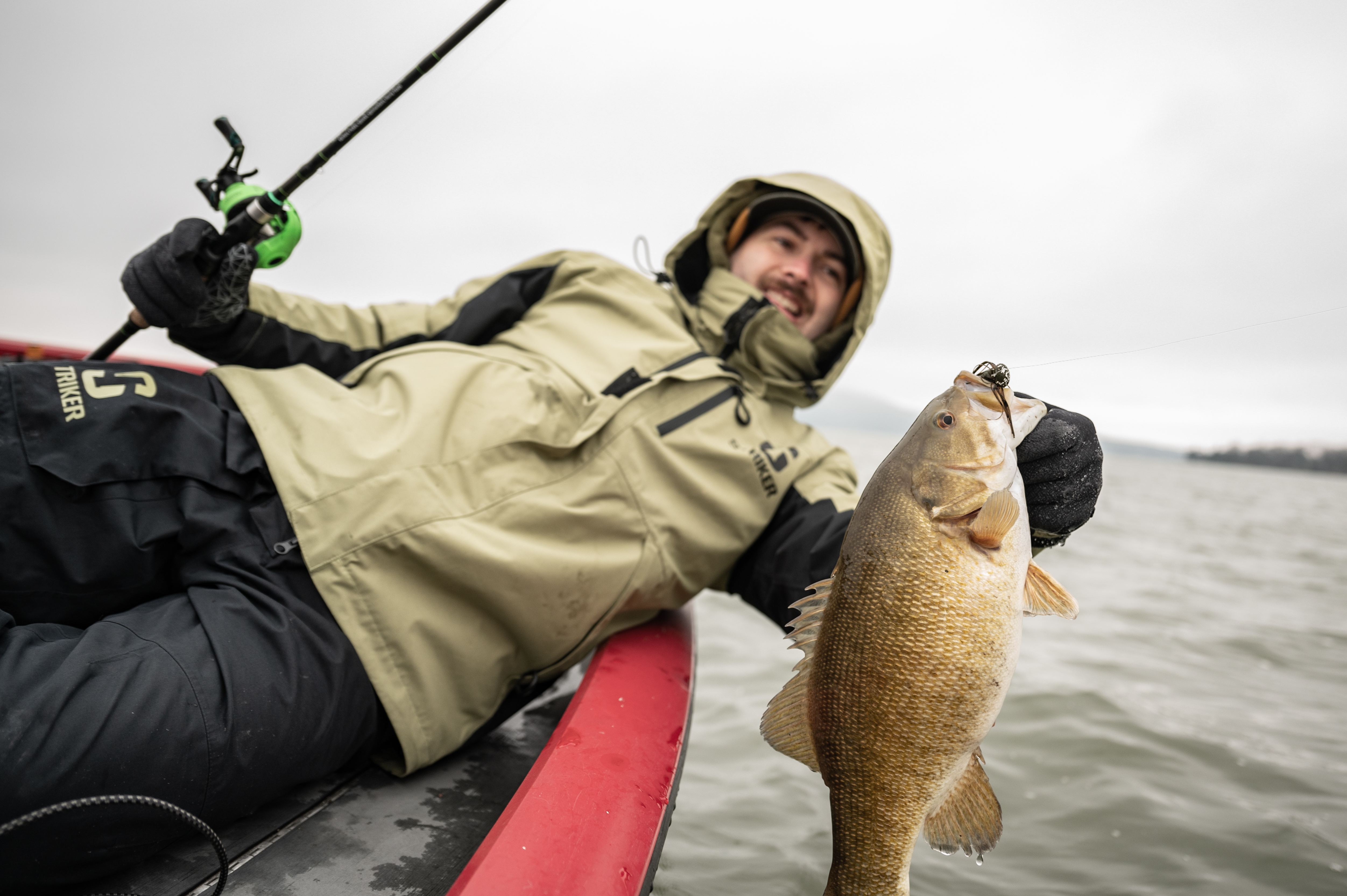 Angler holding up smallmouth bass