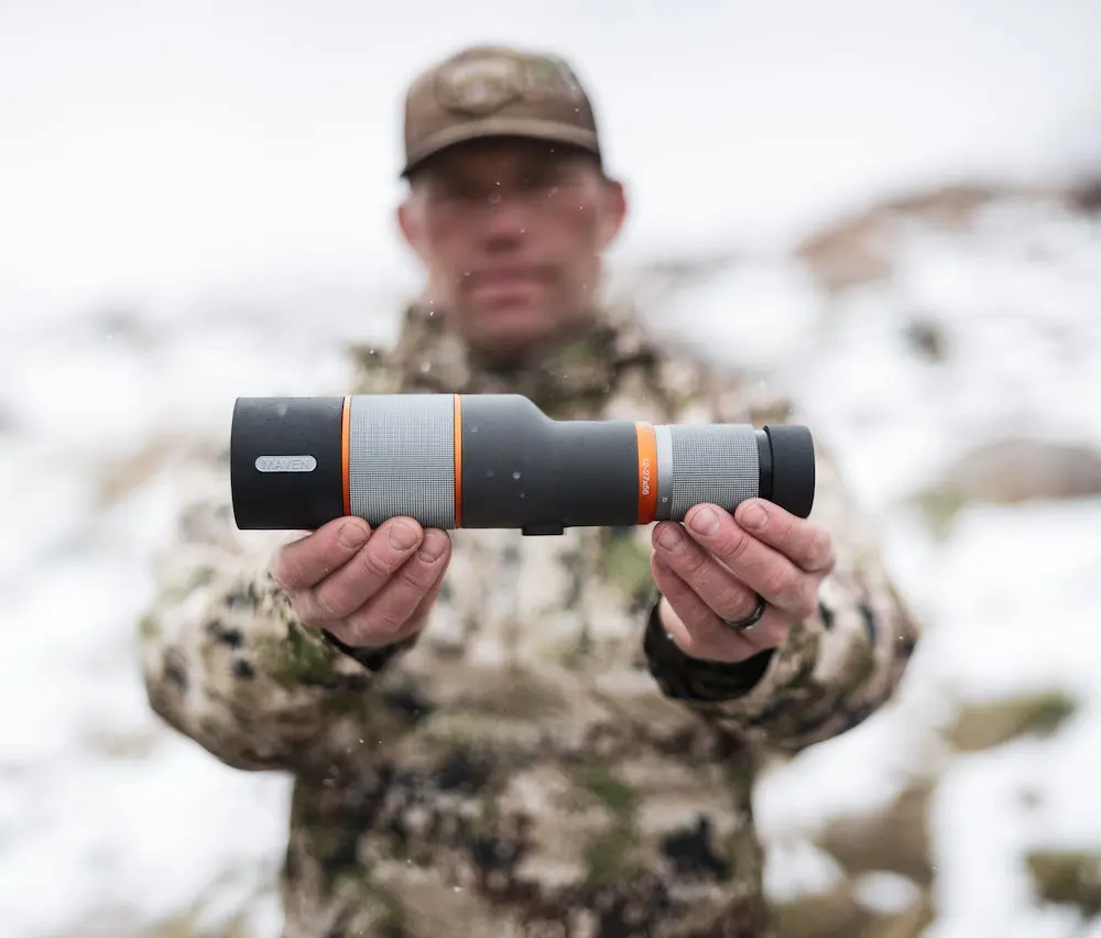 Man holding Maven S2 spotting scope