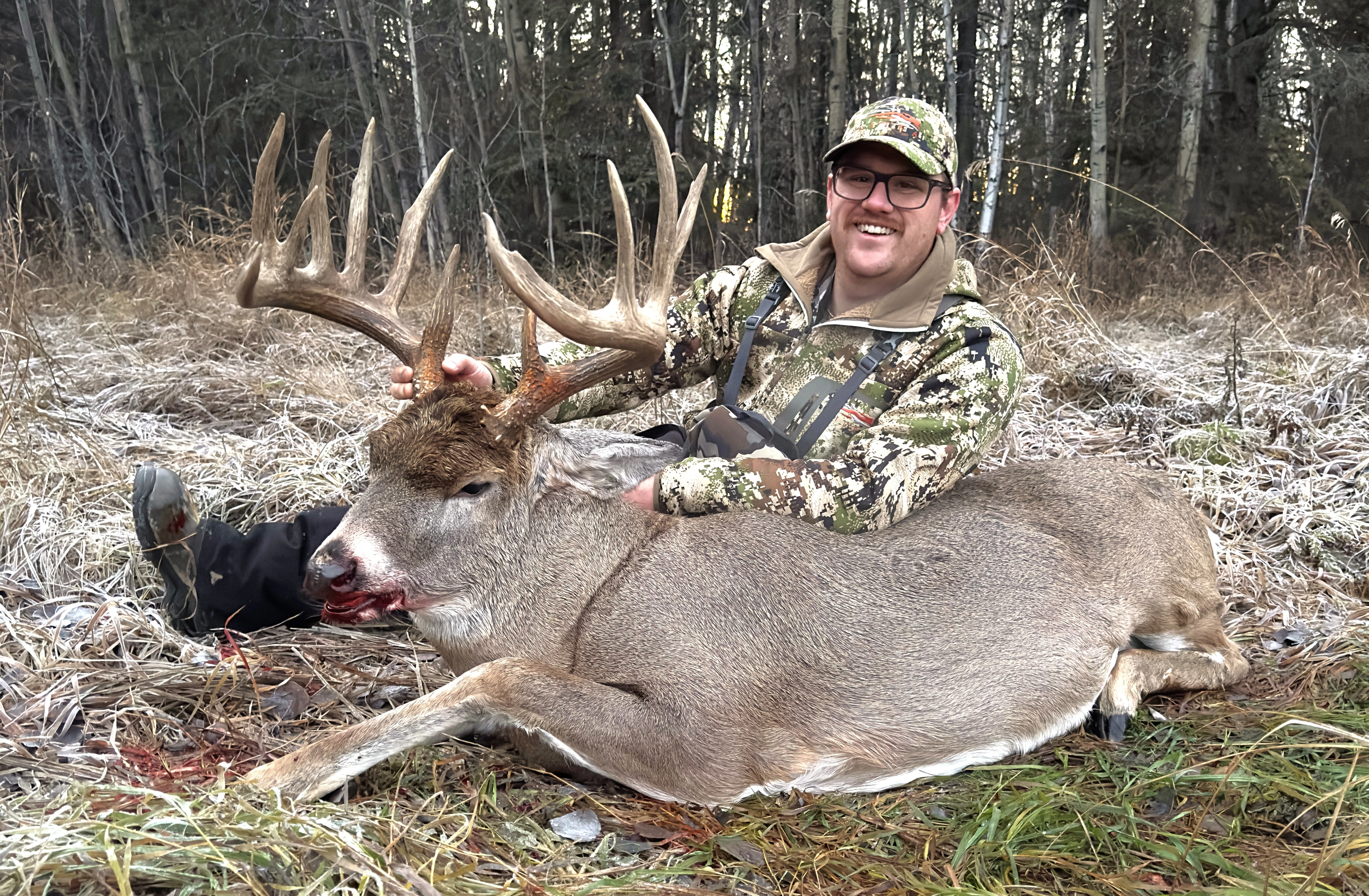 Alberta hunter Nathan Dahl poses with a trophy whitetail buck. 