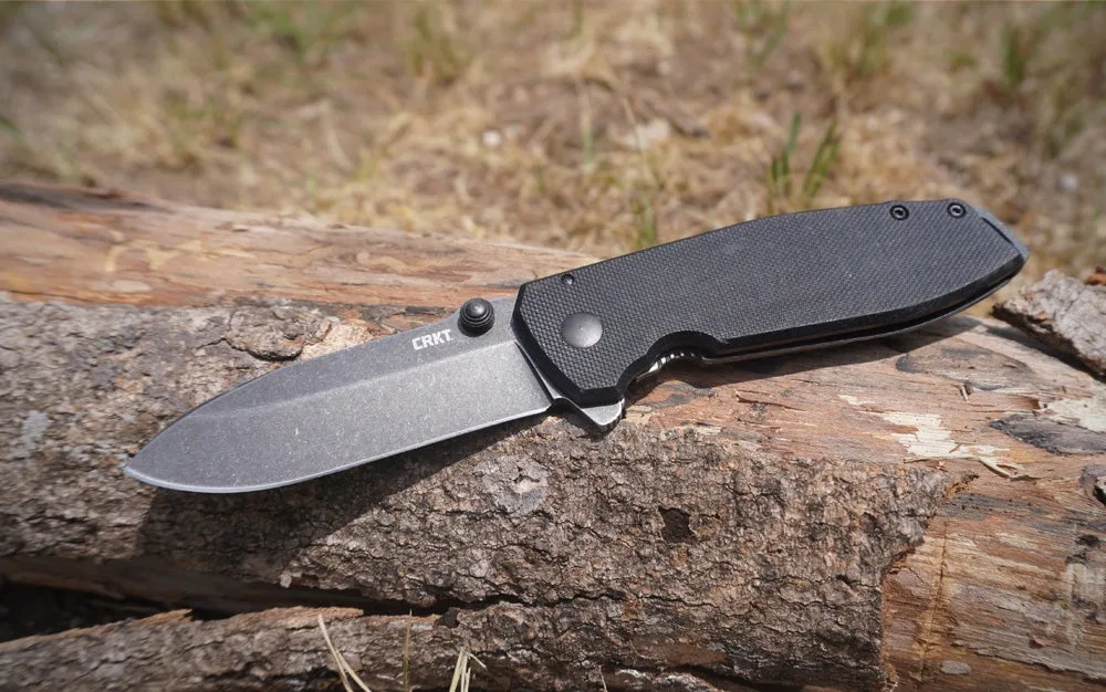 CRKT Squid automatic knife on log