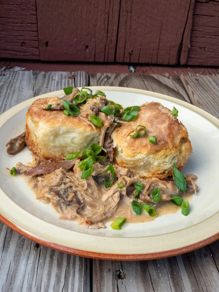 Turkey legs with biscuits and gravy.