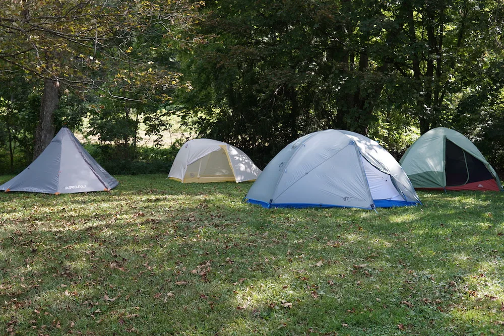 Hunting tents set up on grass during testing