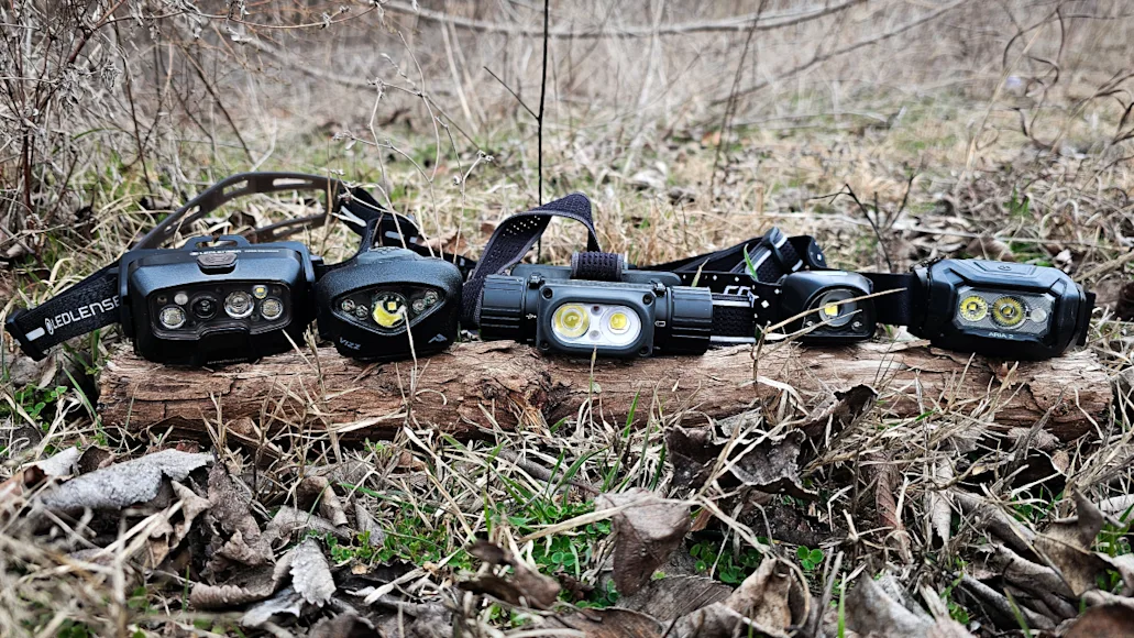 Best headlamps we tested lined up on log in forest