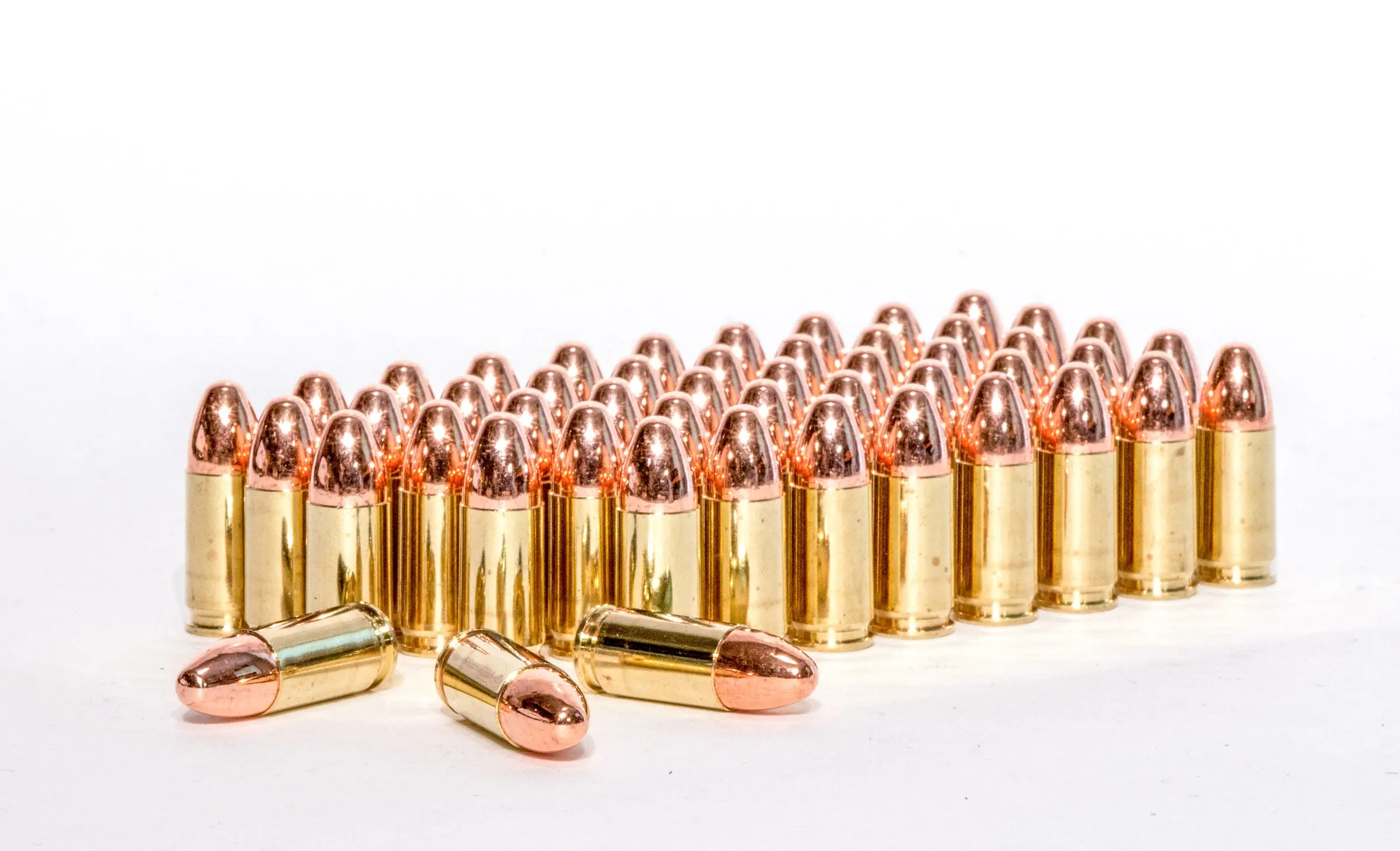 Handgun ammo on a white background.