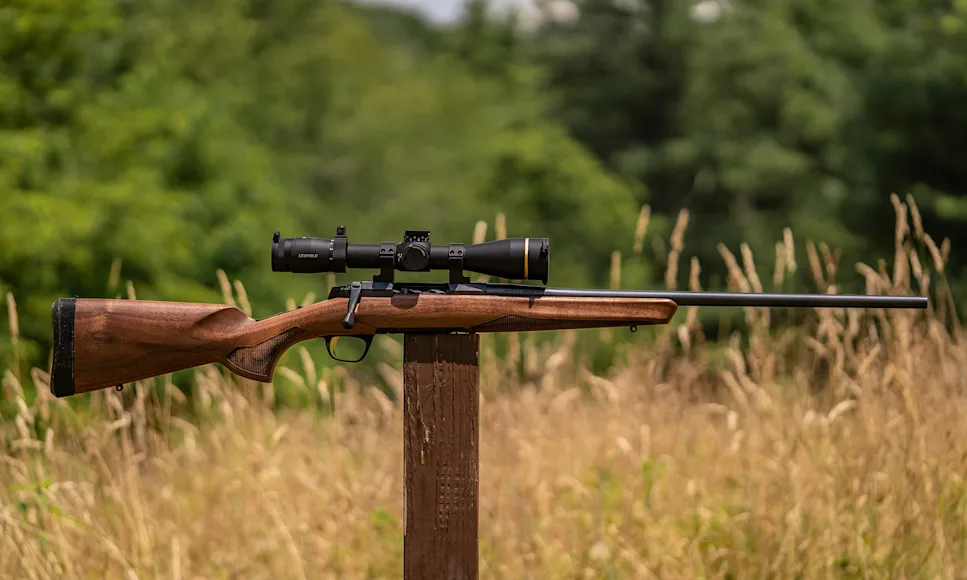 The new Browning X-Bolt 2 Hunter rifle balanced on a post in a field.