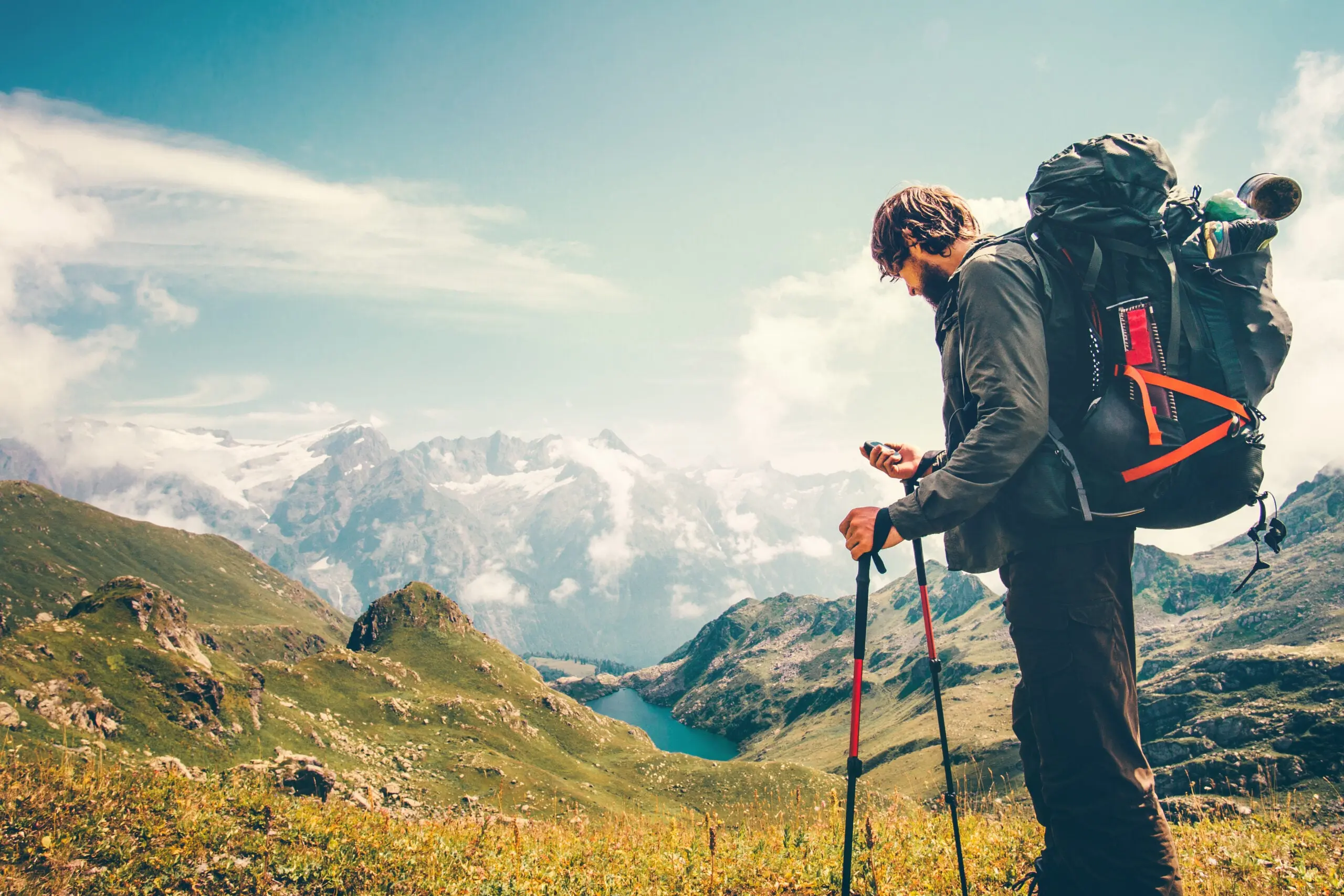 Photo of a backpacker using a GPS device