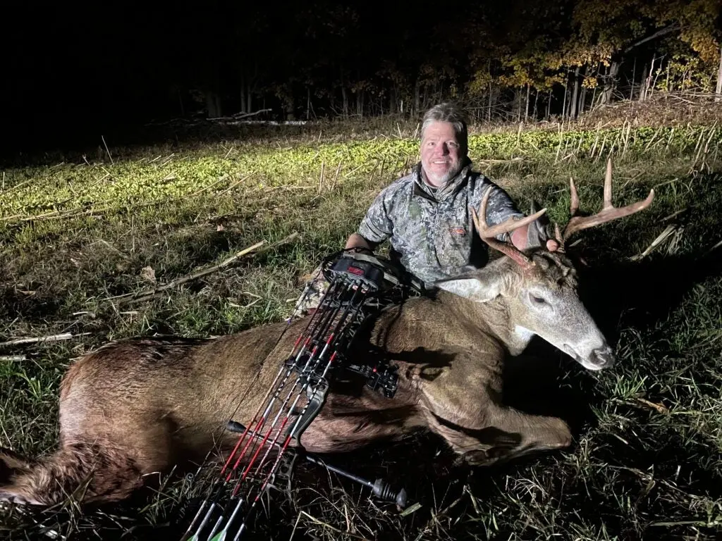 photo of hunter with deer