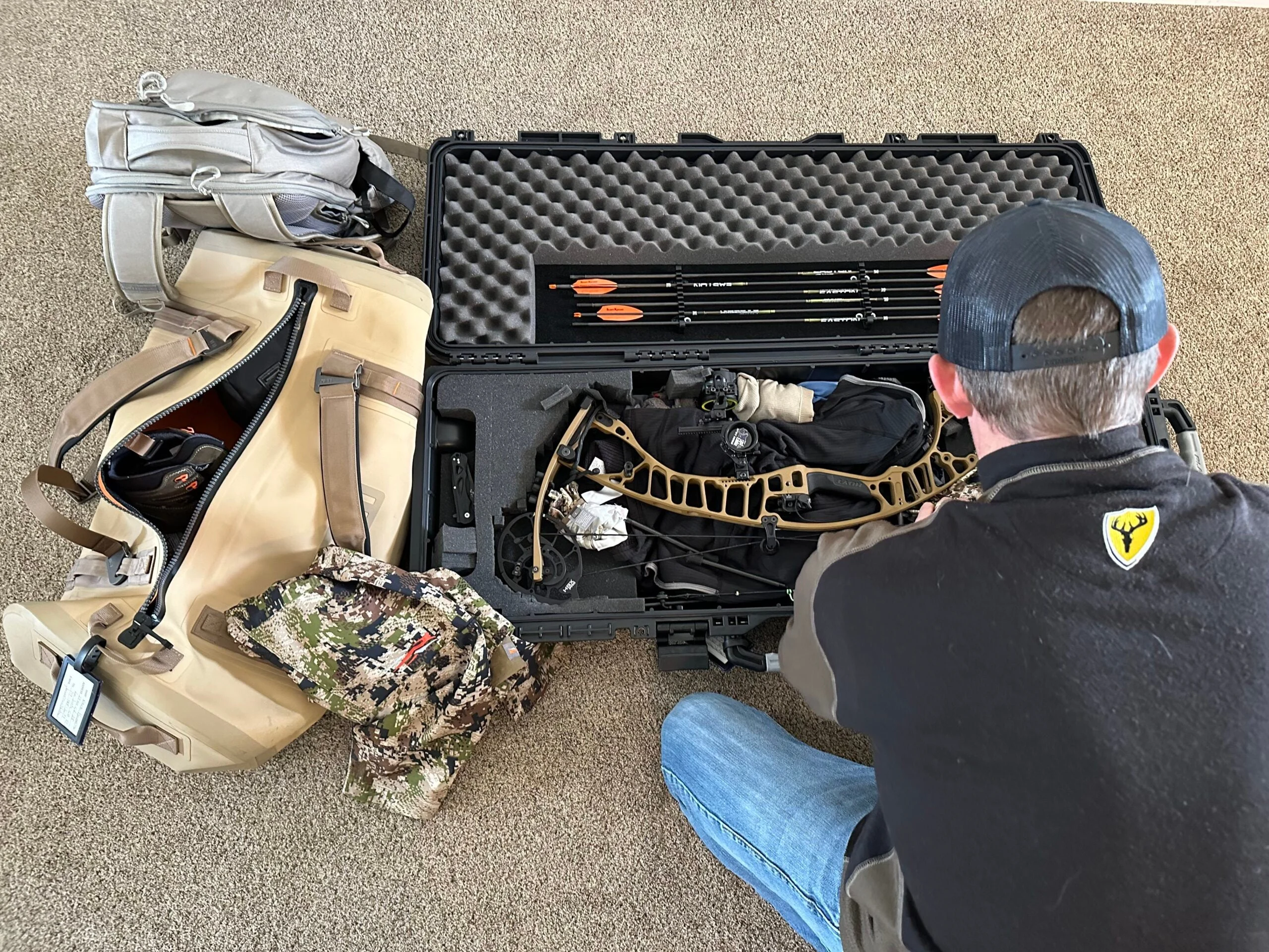 hunter packing his bow case