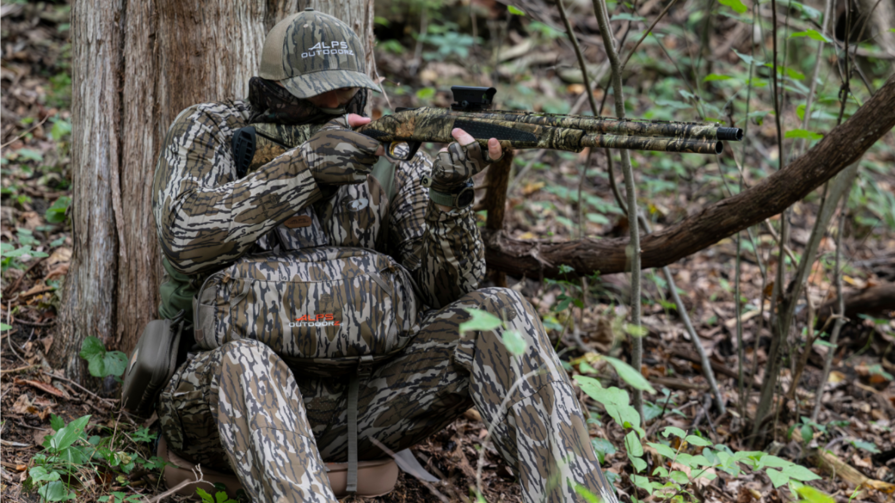 Hunter wearing Alps OutdoorZ Turkey Hunting Gear in woods