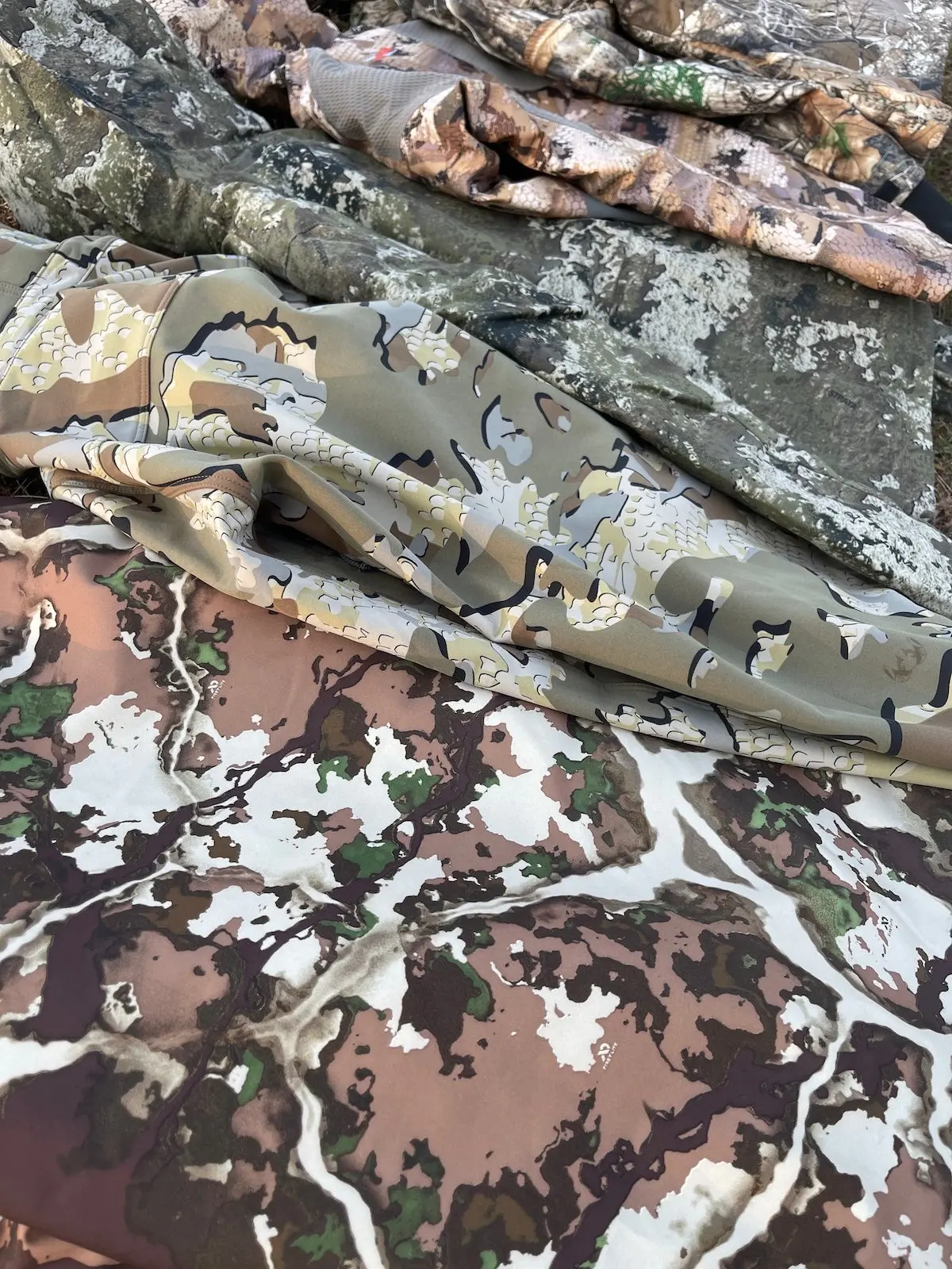 Close-up of different hunting camos on jackets