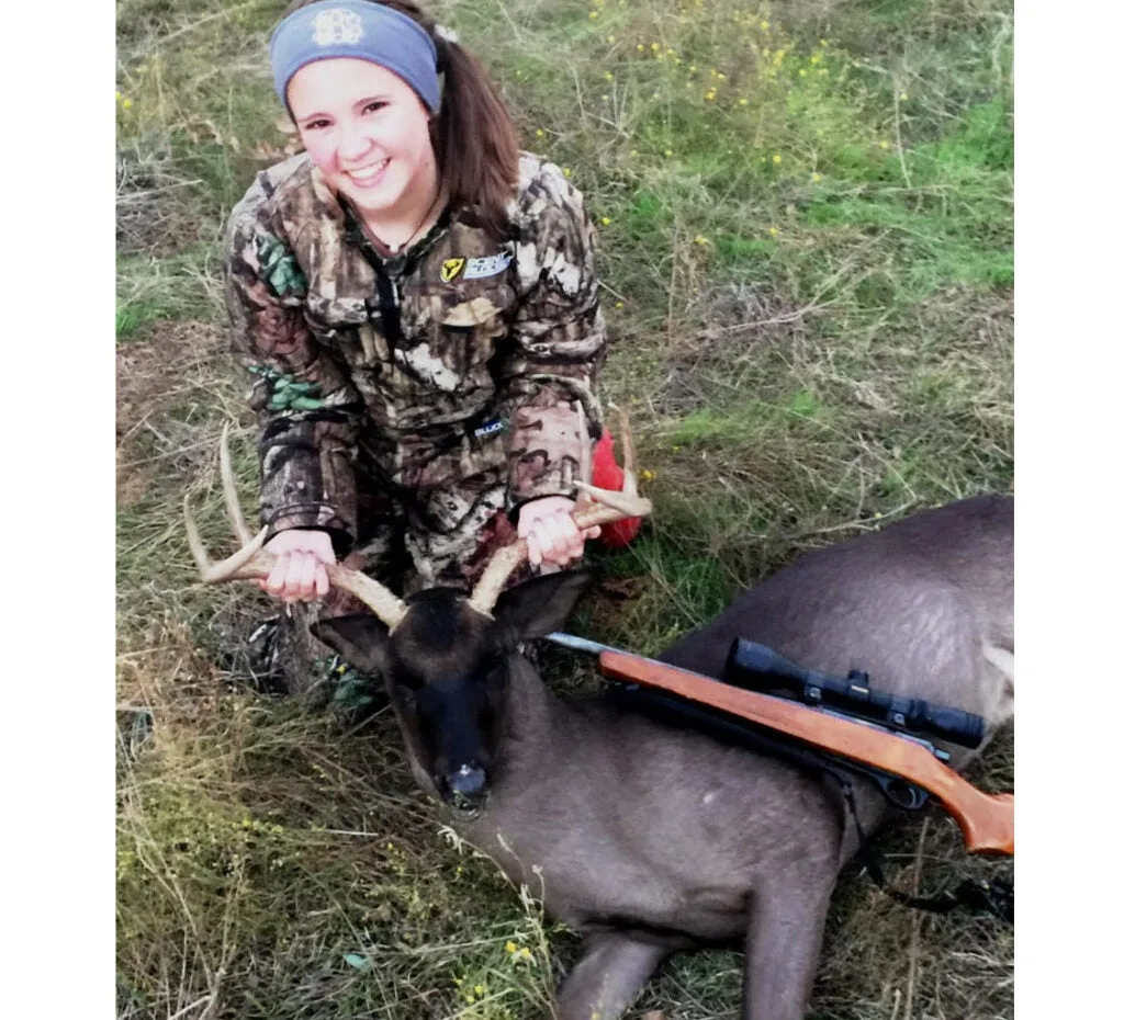 hunter with a black whitetail deerdeer