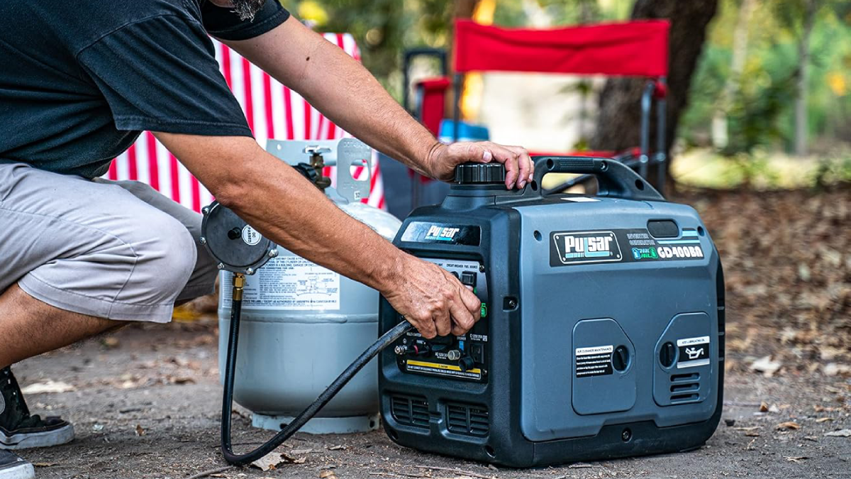 Man hooking Pulsar dual fuel generator up to propane tank