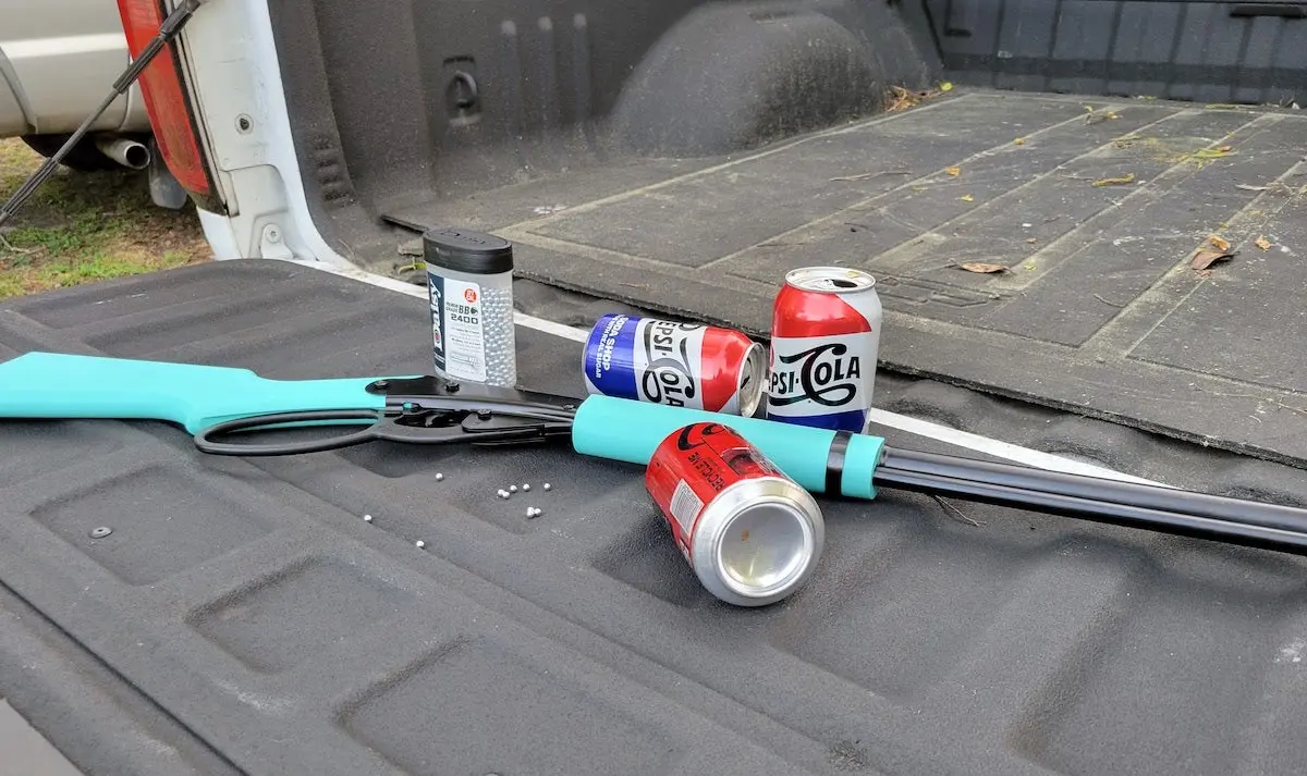 Blue Daisy Carbine BB Gun sitting on truck bed